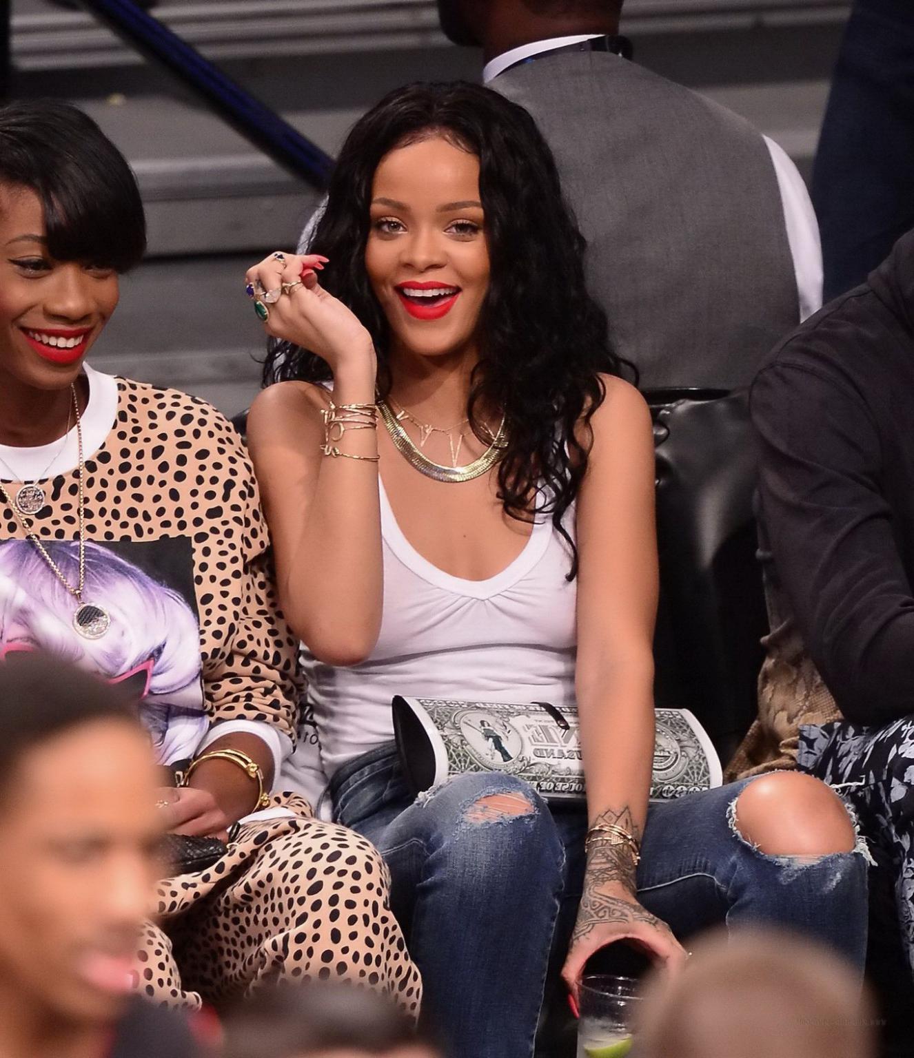 16P Rihanna shows off her boobs in seethru top at a basketball game in NYC