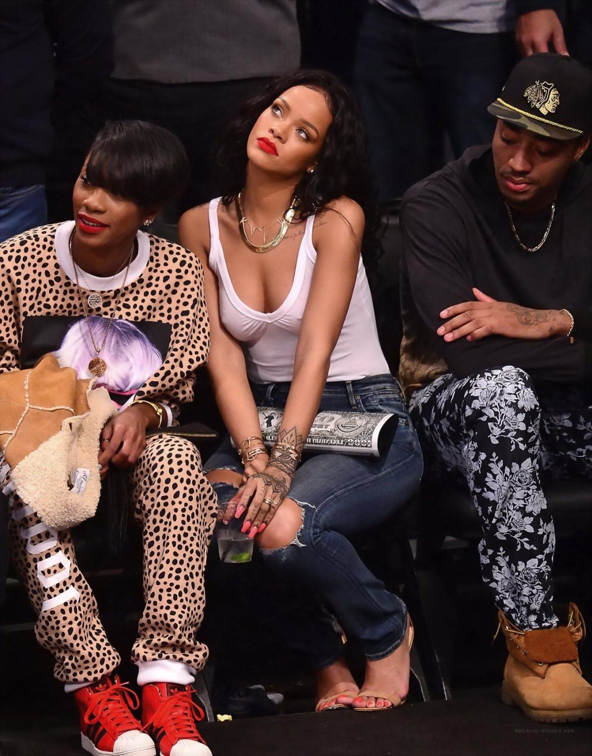 16P Rihanna shows off her boobs in seethru top at a basketball game in NYC