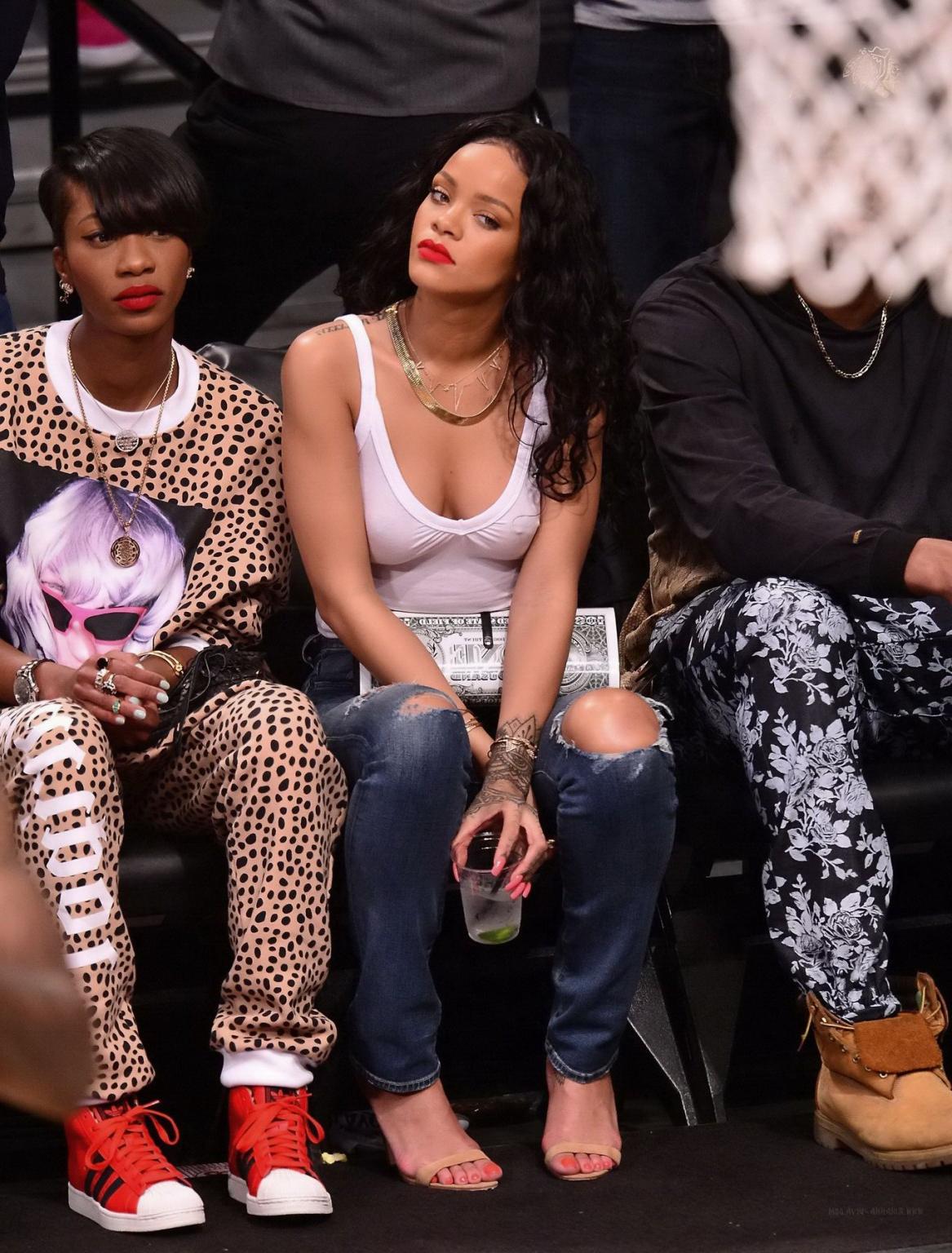 16P Rihanna shows off her boobs in seethru top at a basketball game in NYC
