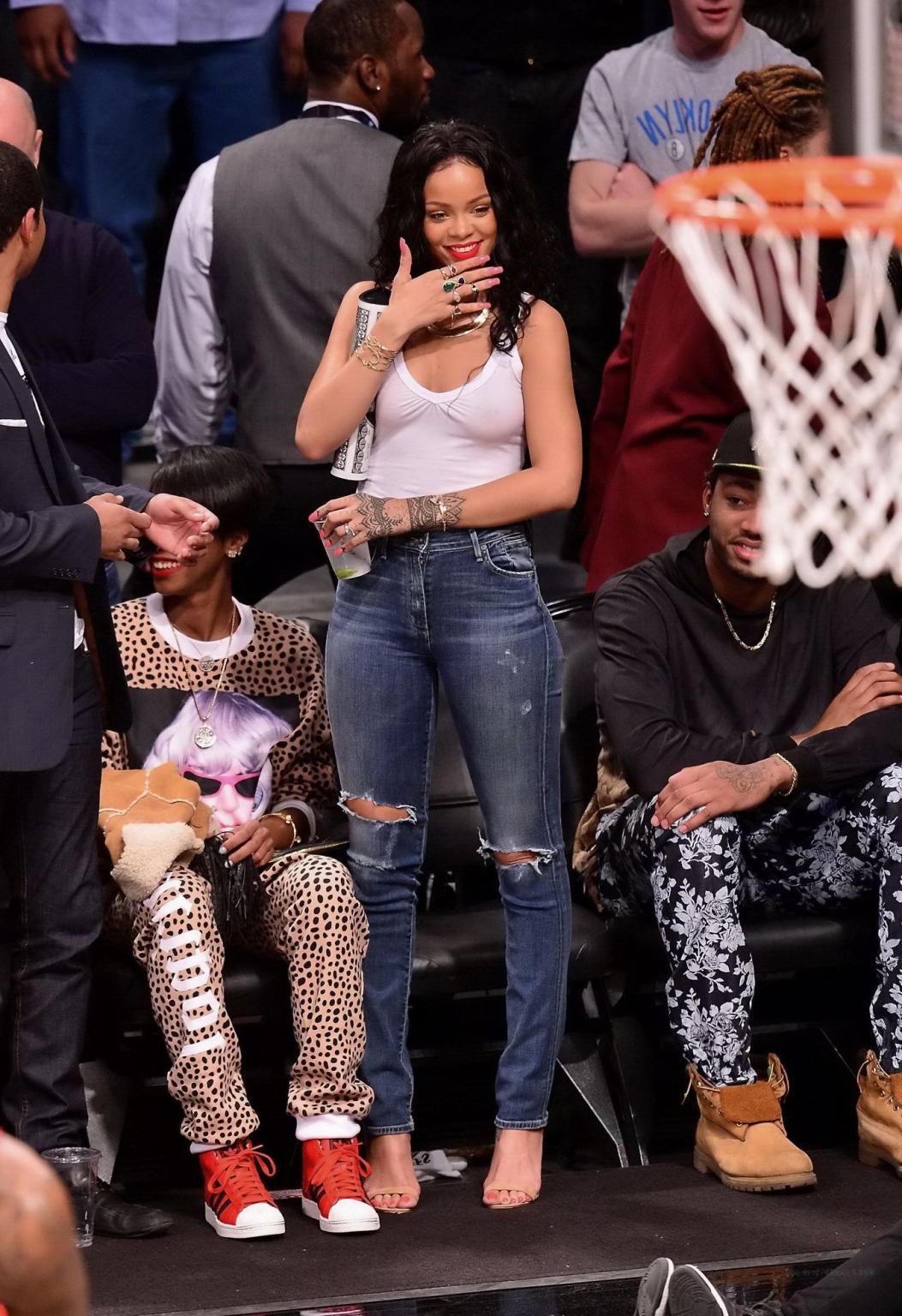 16P Rihanna shows off her boobs in seethru top at a basketball game in NYC