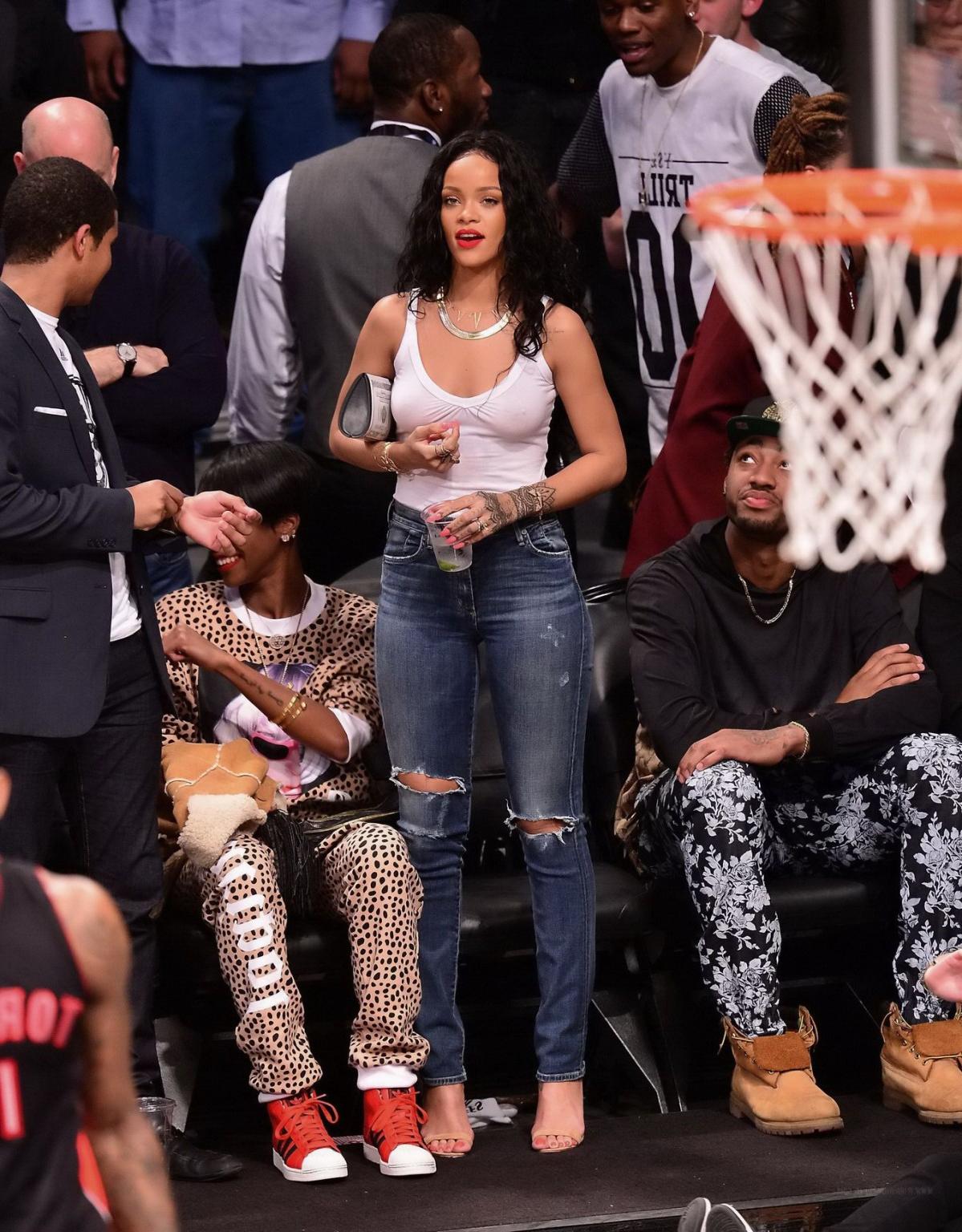 16P Rihanna shows off her boobs in seethru top at a basketball game in NYC