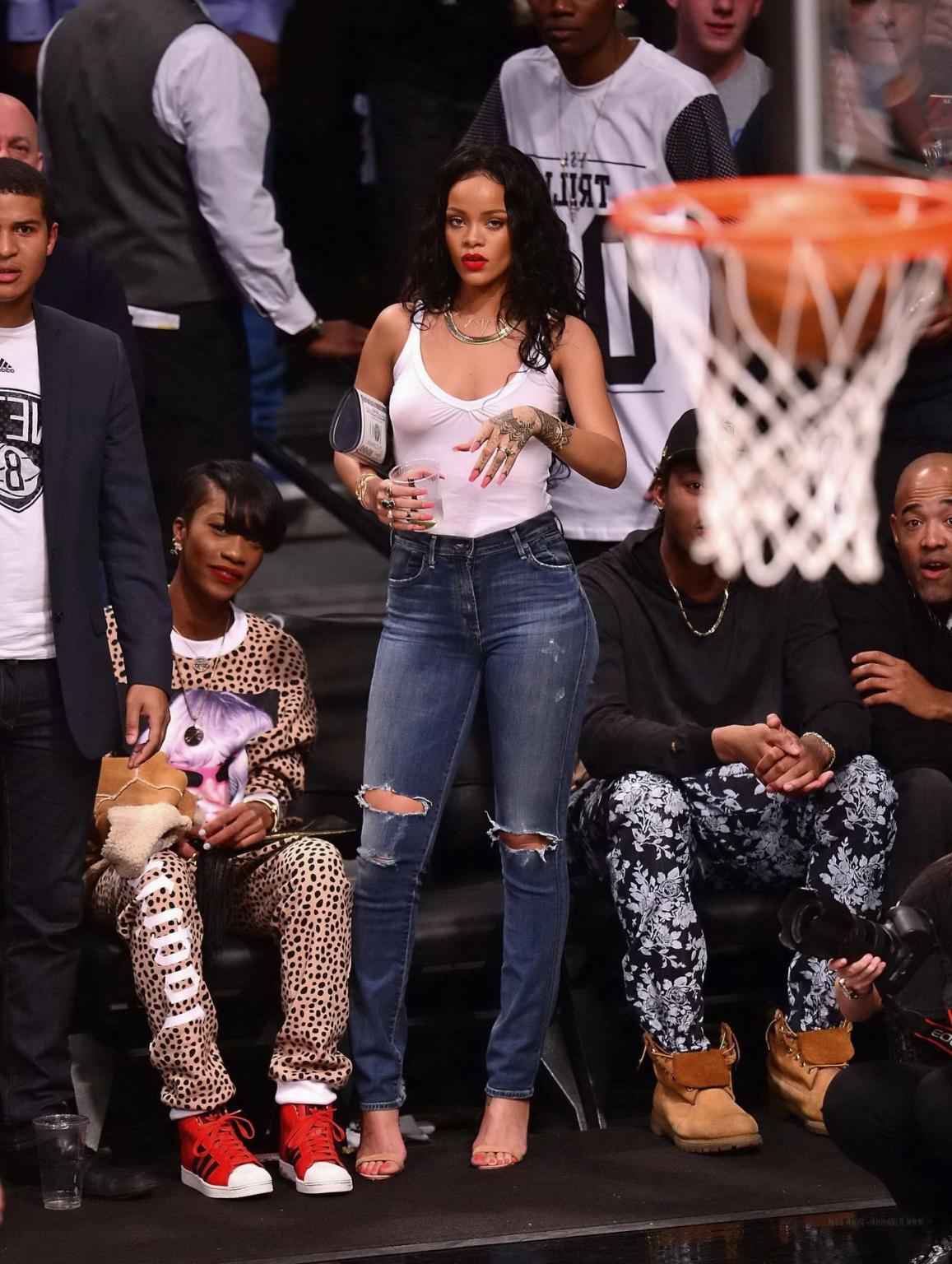 16P Rihanna shows off her boobs in seethru top at a basketball game in NYC