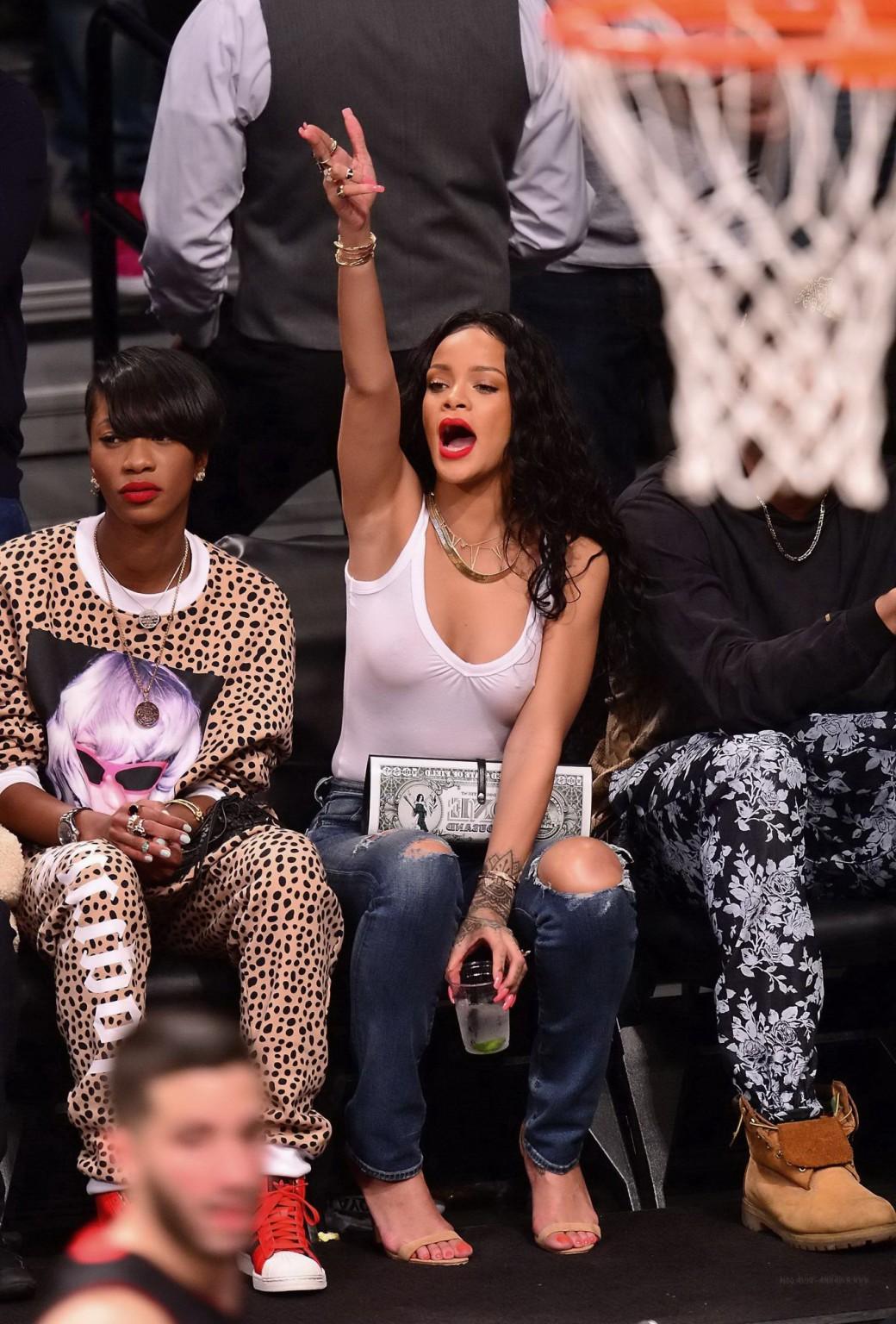 16P Rihanna shows off her boobs in seethru top at a basketball game in NYC