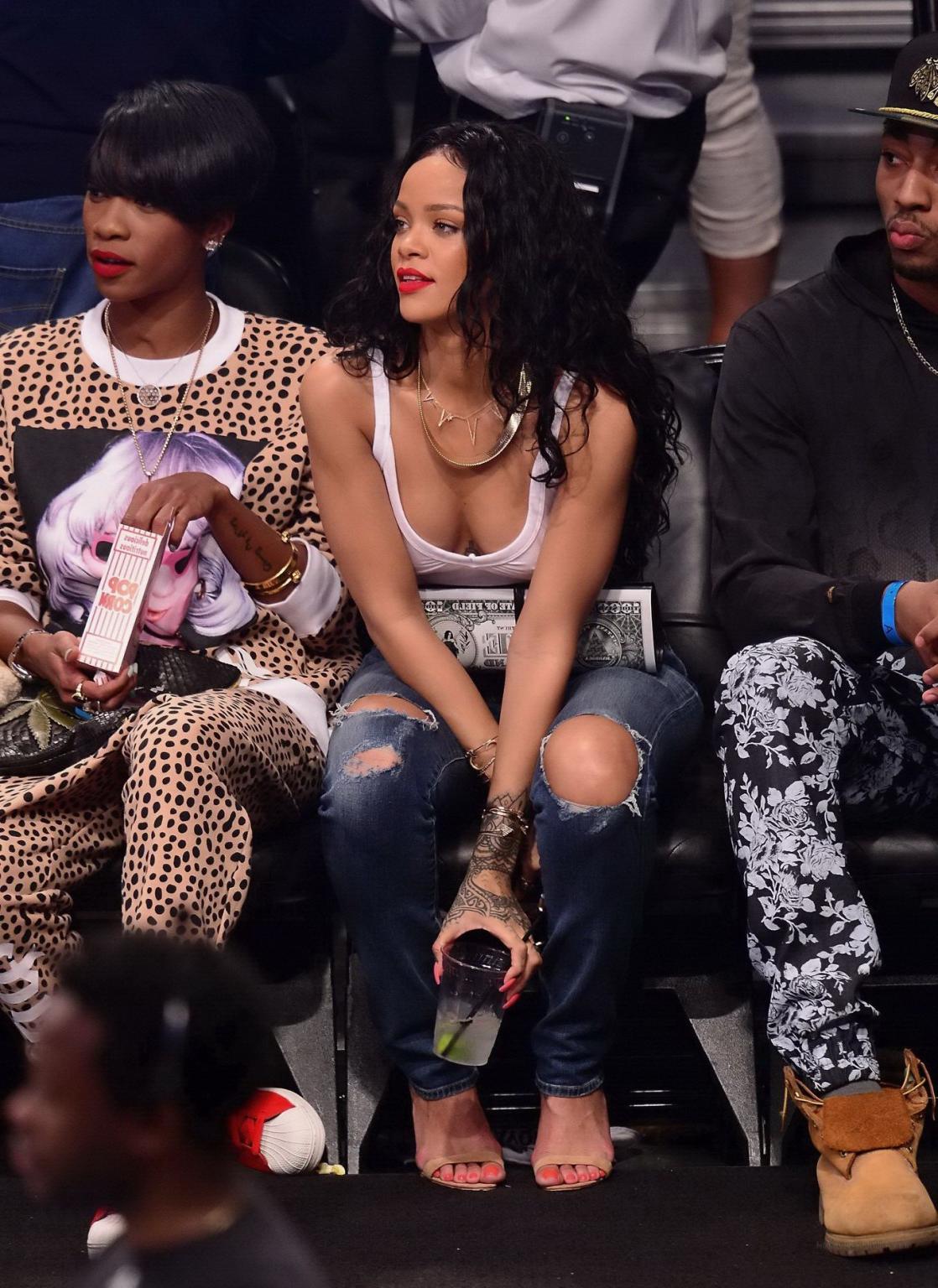 16P Rihanna shows off her boobs in seethru top at a basketball game in NYC