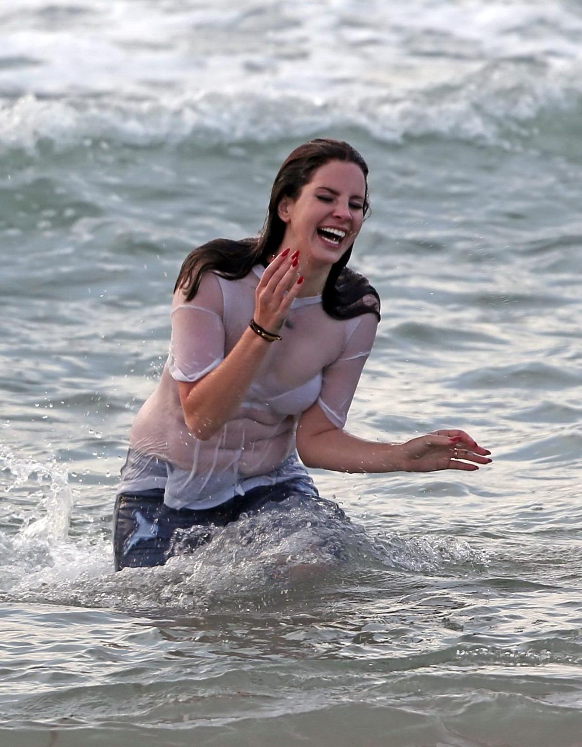 16P Lana Del Rey in white bra and wet Tshirt shooting a music video in Marina Del Re