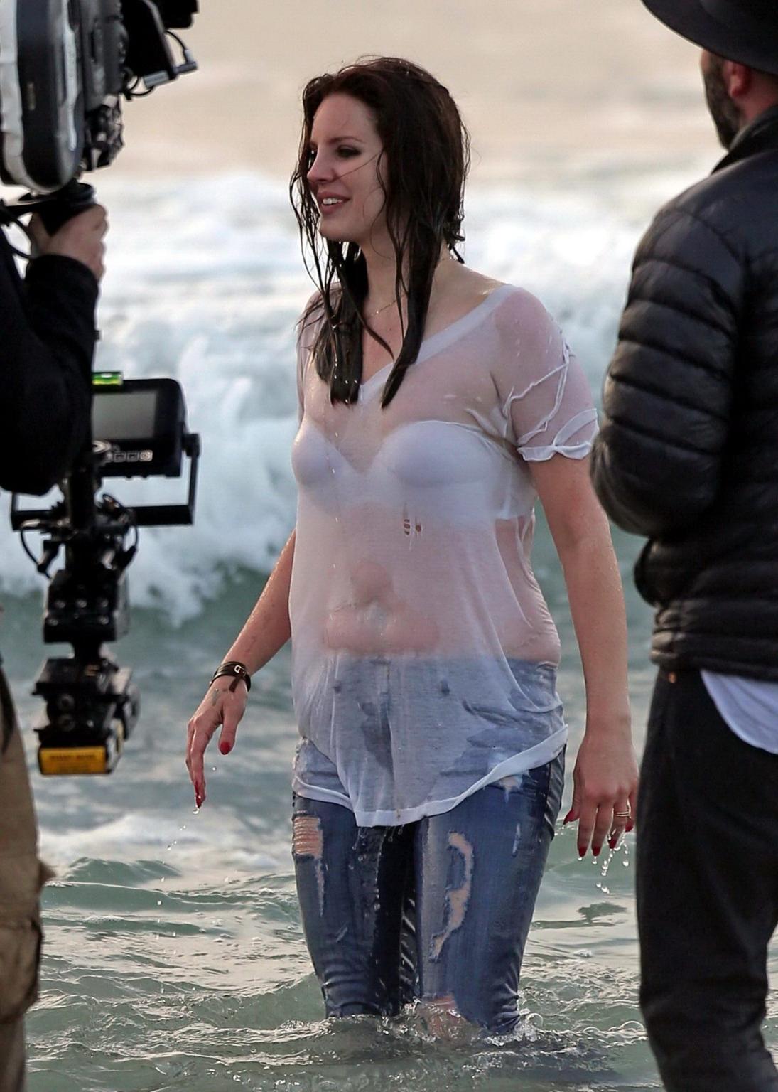 16P Lana Del Rey in white bra and wet Tshirt shooting a music video in Marina Del Re