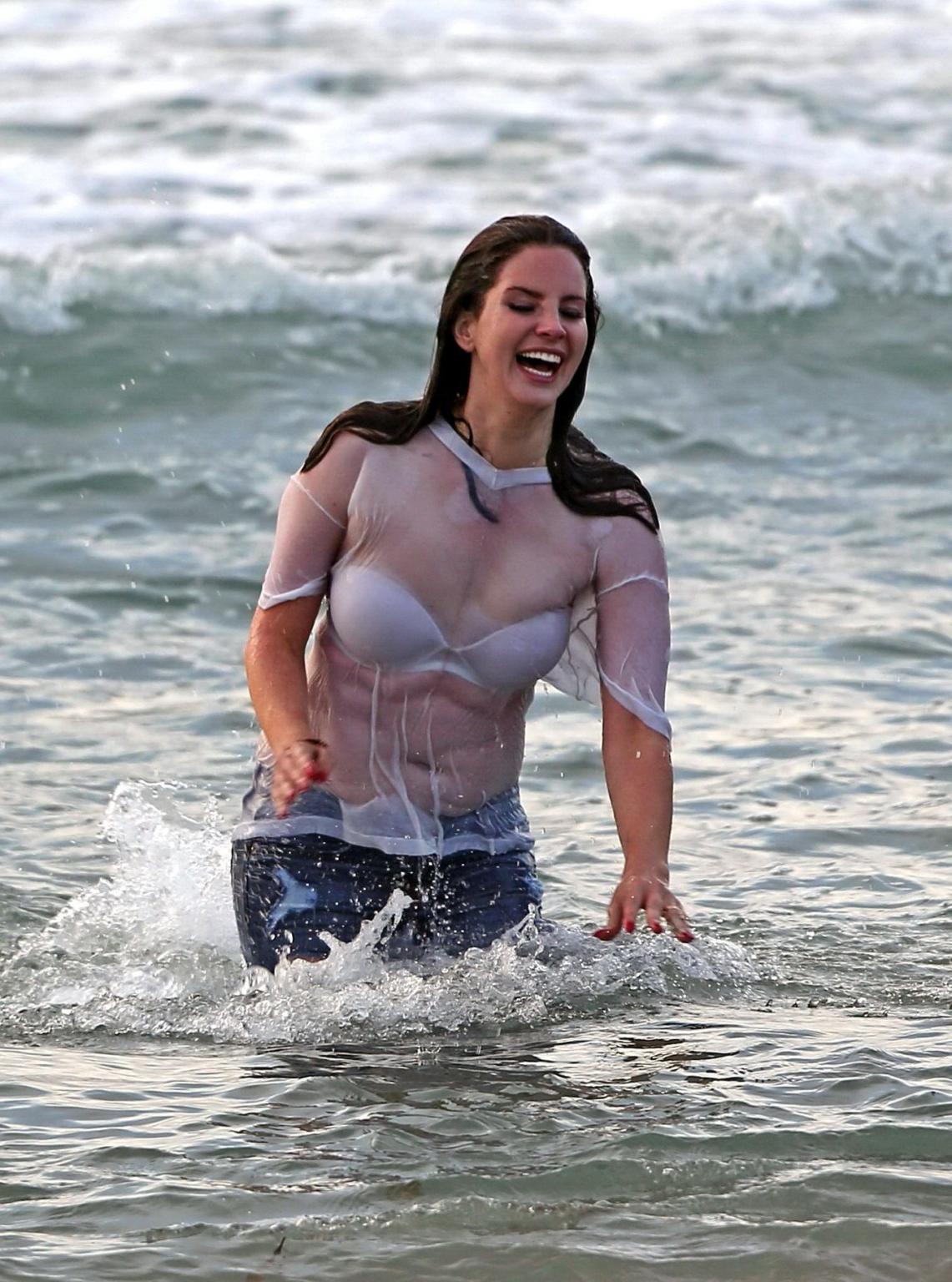 16P Lana Del Rey in white bra and wet Tshirt shooting a music video in Marina Del Re