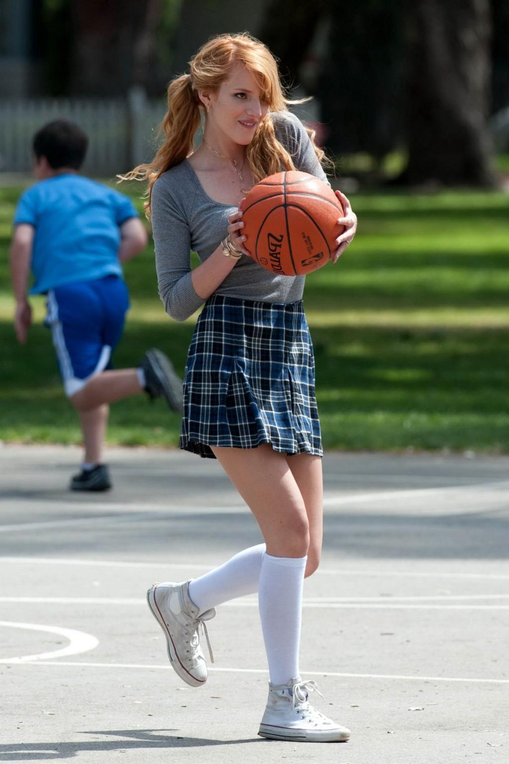 16P Bella Thorne playing basketball in a schoolgirl outfit on the set of Mostly Ghos