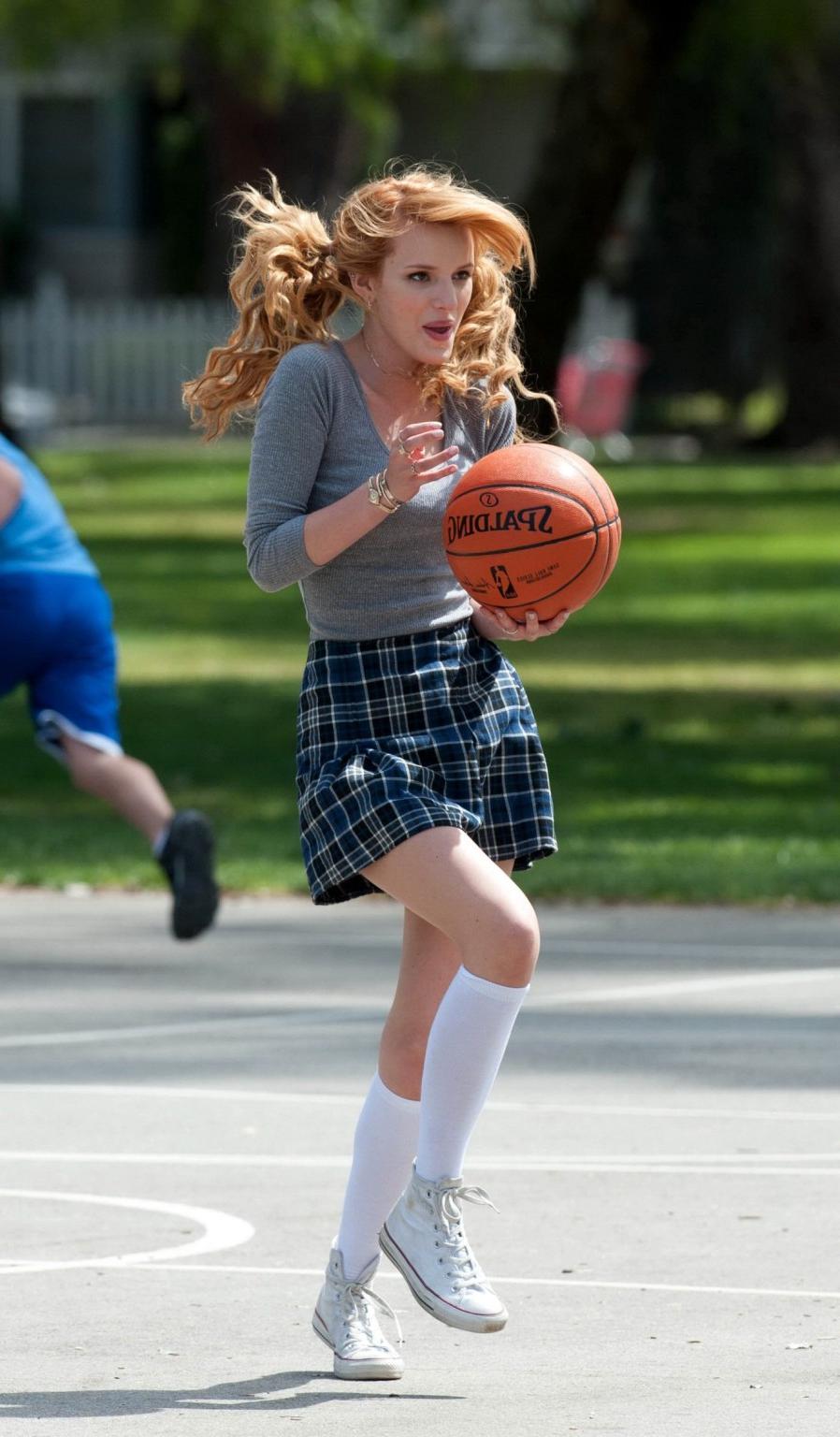 16P Bella Thorne playing basketball in a schoolgirl outfit on the set of Mostly Ghos