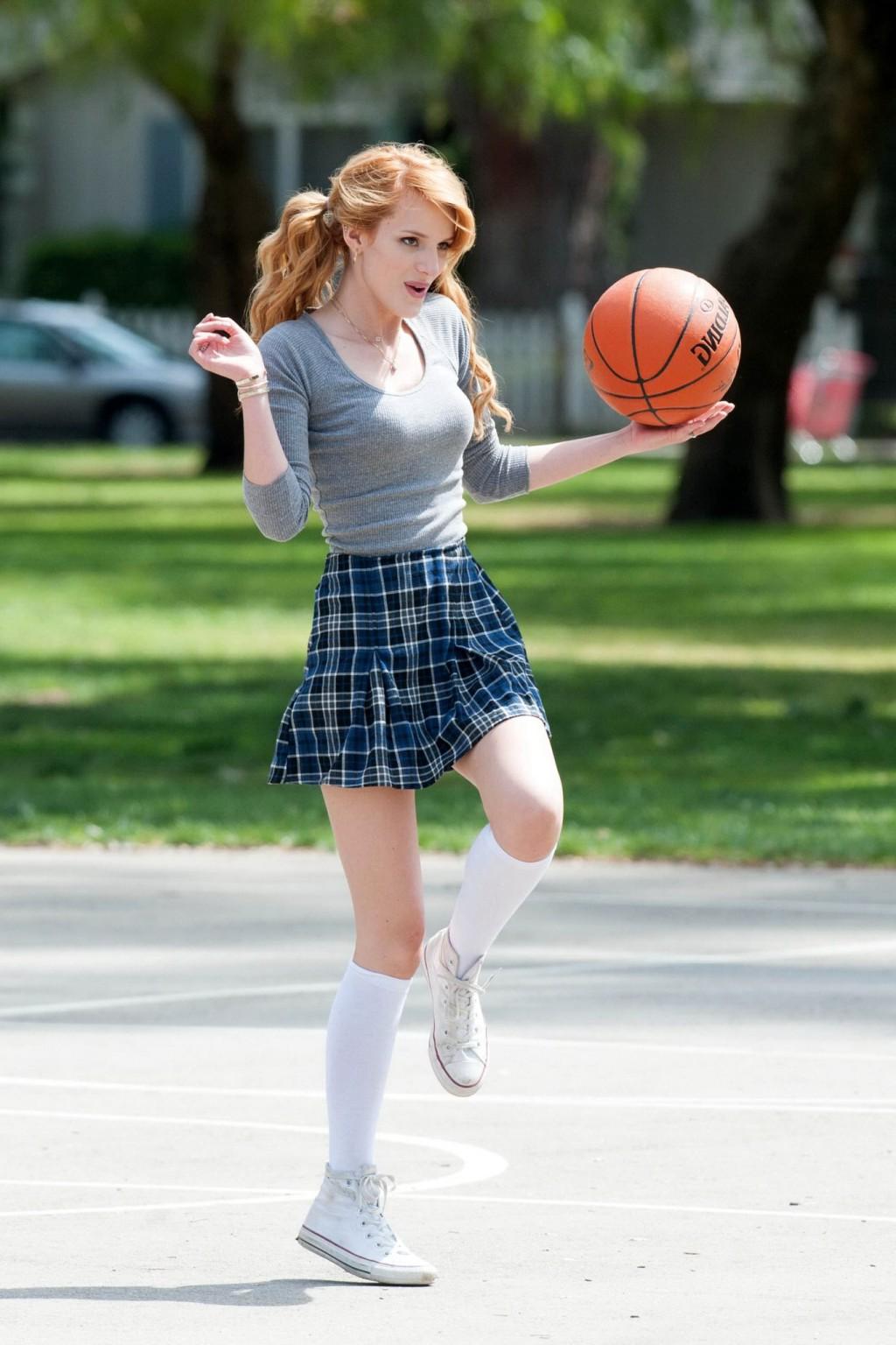 16P Bella Thorne playing basketball in a schoolgirl outfit on the set of Mostly Ghos