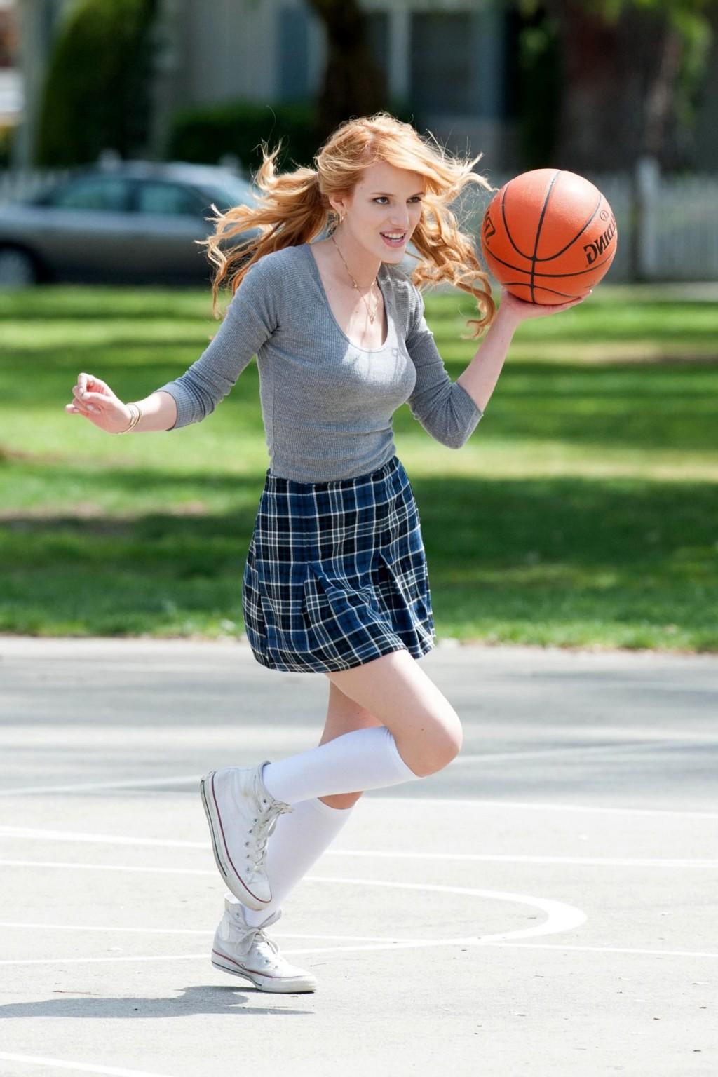 16P Bella Thorne playing basketball in a schoolgirl outfit on the set of Mostly Ghos