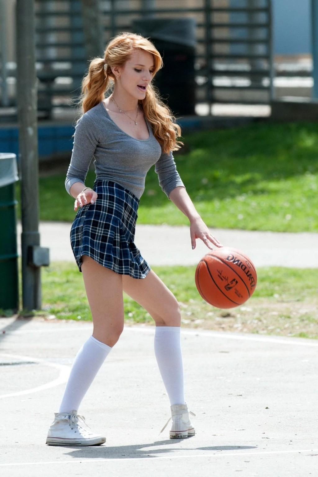 16P Bella Thorne playing basketball in a schoolgirl outfit on the set of Mostly Ghos