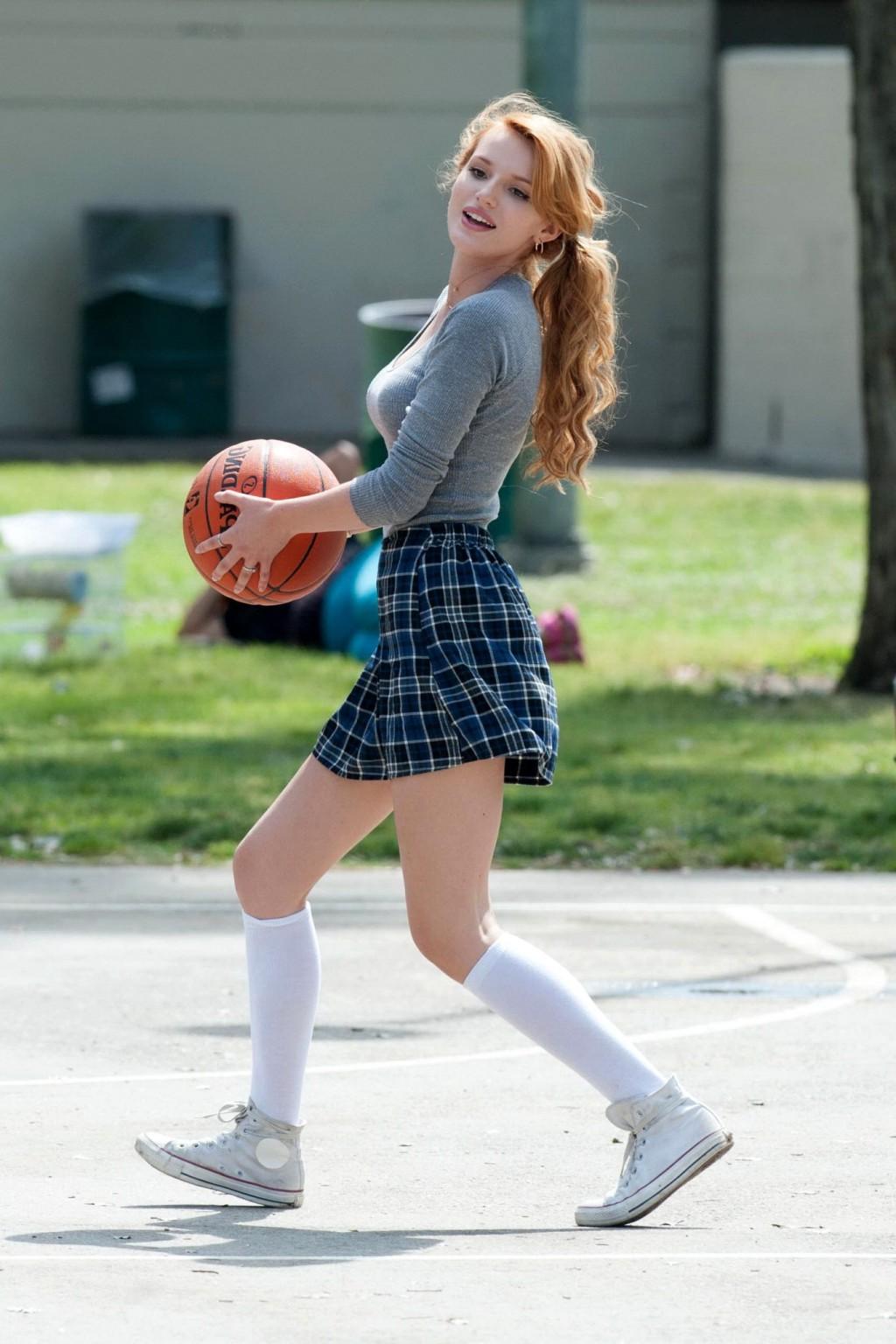 16P Bella Thorne playing basketball in a schoolgirl outfit on the set of Mostly Ghos