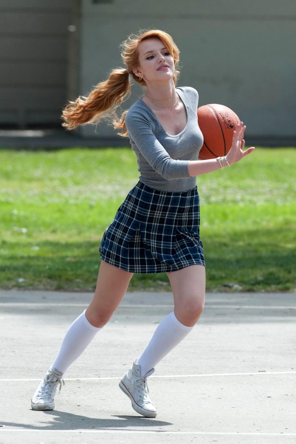 16P Bella Thorne playing basketball in a schoolgirl outfit on the set of Mostly Ghos