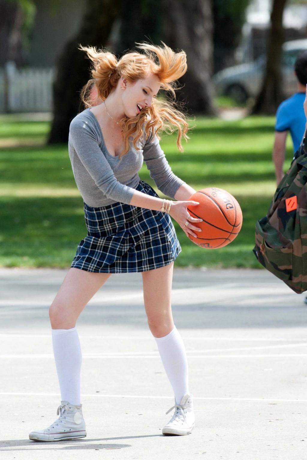 16P Bella Thorne playing basketball in a schoolgirl outfit on the set of Mostly Ghos