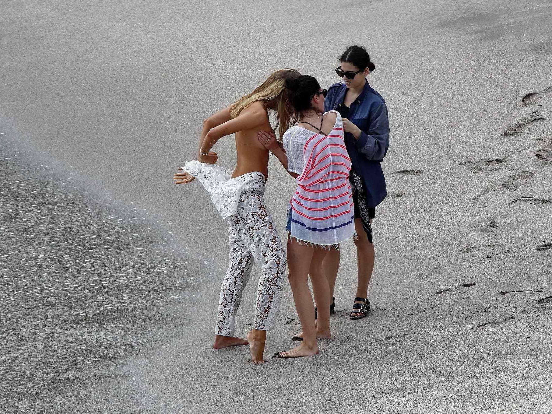 16P Maryna Linchuk getting her boobs groped while changing on the set of a Vogue pho