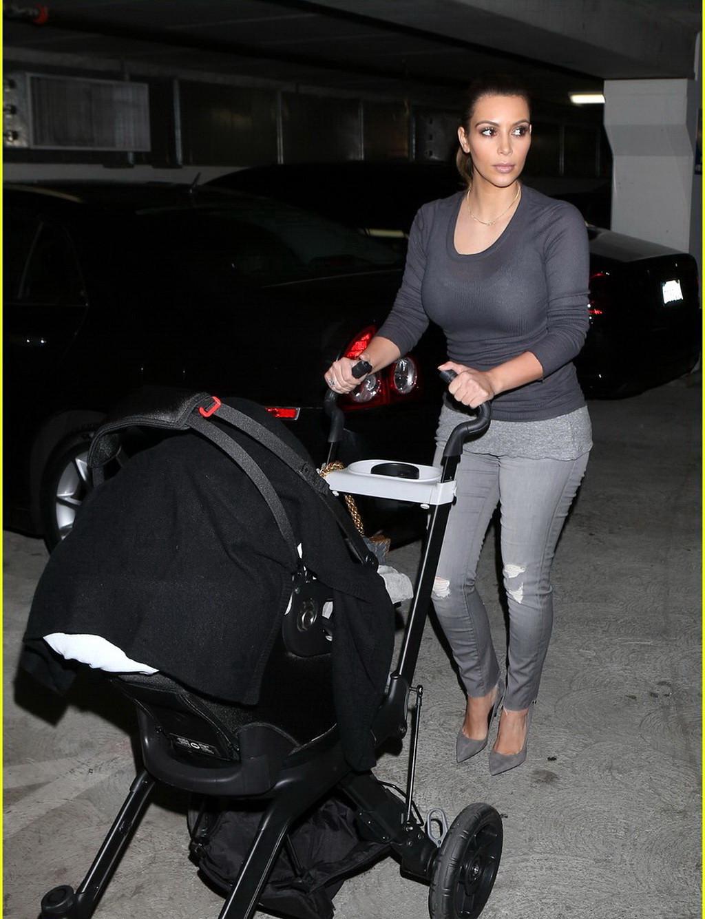 16P Kim Kardashian see through to bra while out shopping