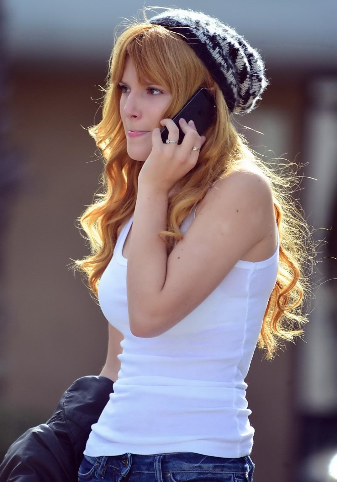 16P Bella Thorne wearing see-through to bra top and jeans out in Studio City