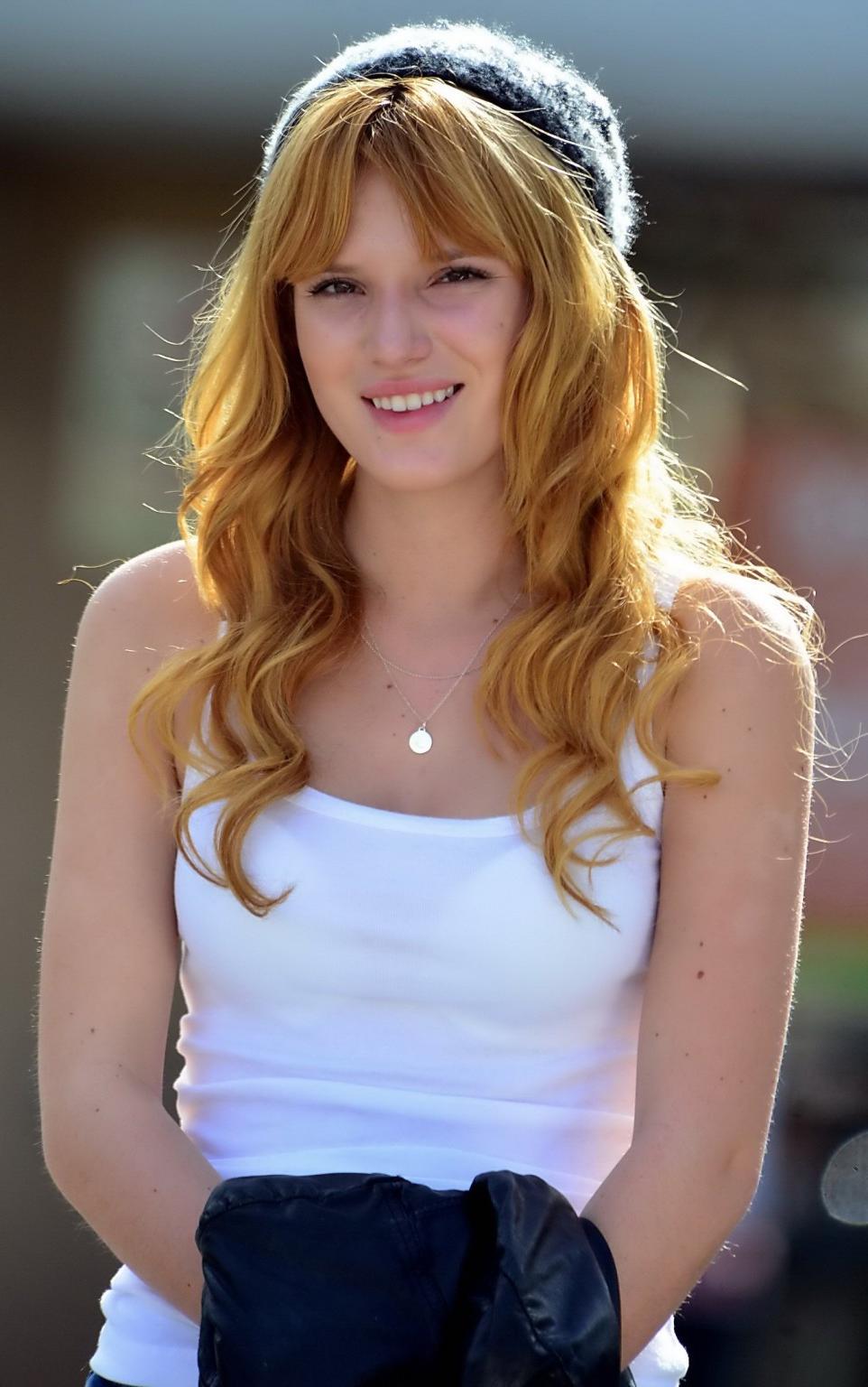 16P Bella Thorne wearing see-through to bra top and jeans out in Studio City
