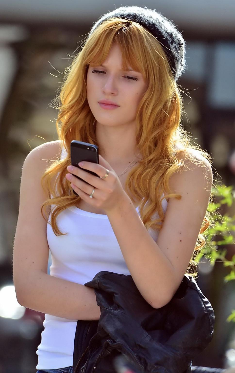 16P Bella Thorne wearing see-through to bra top and jeans out in Studio City