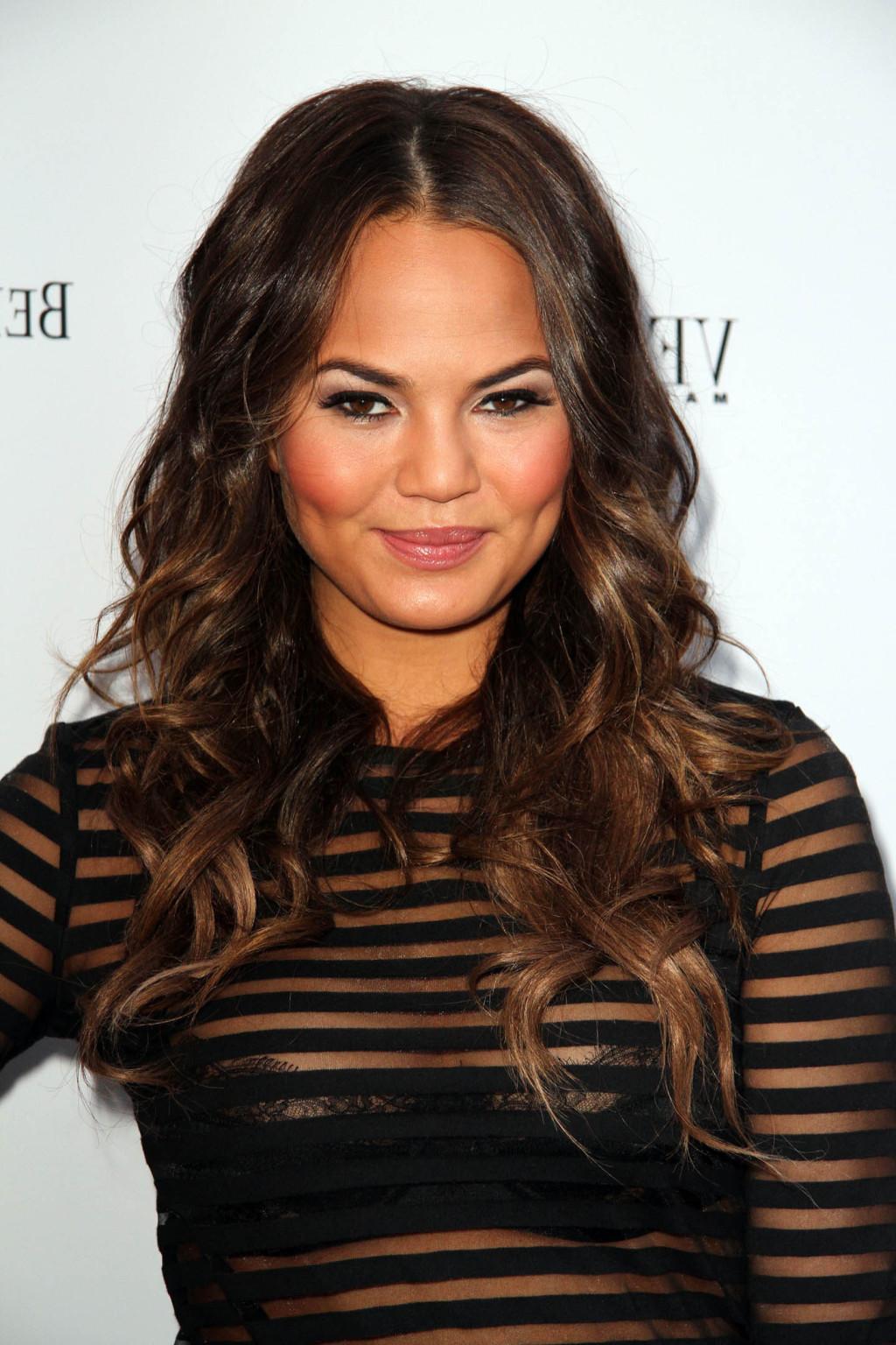 16P Chrissy Teigen shows off her big boobs wearing a see through bra under a see thr