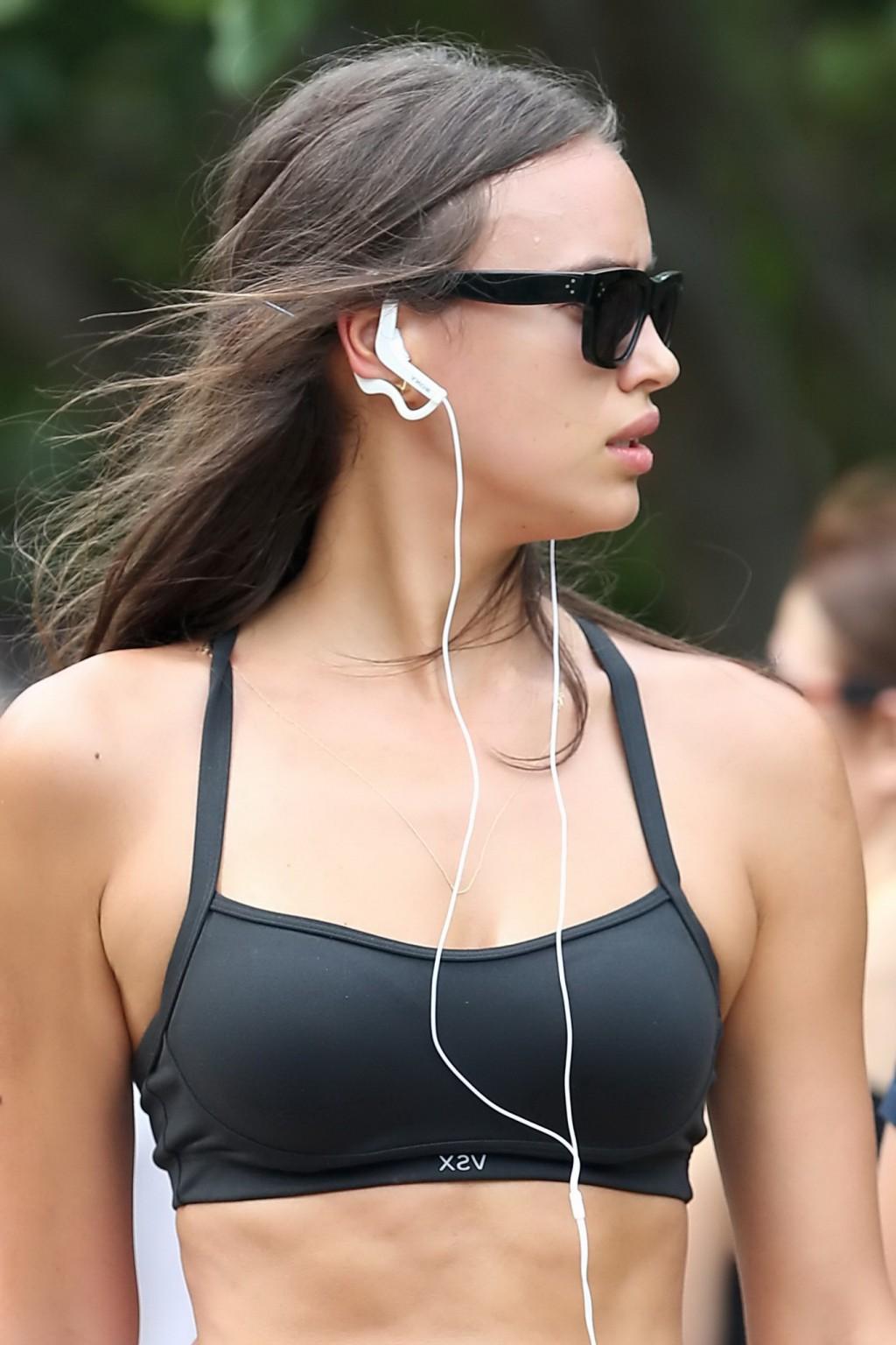 16P Irina Shayk in a skimpy sports bra and shorts heading to the beach in Miami