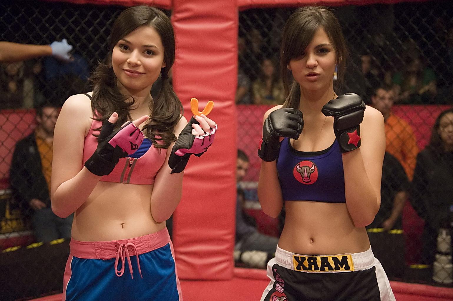 16P Miranda Cosgrove wearing sports bra and shorts boxing with Victoria Justice on t