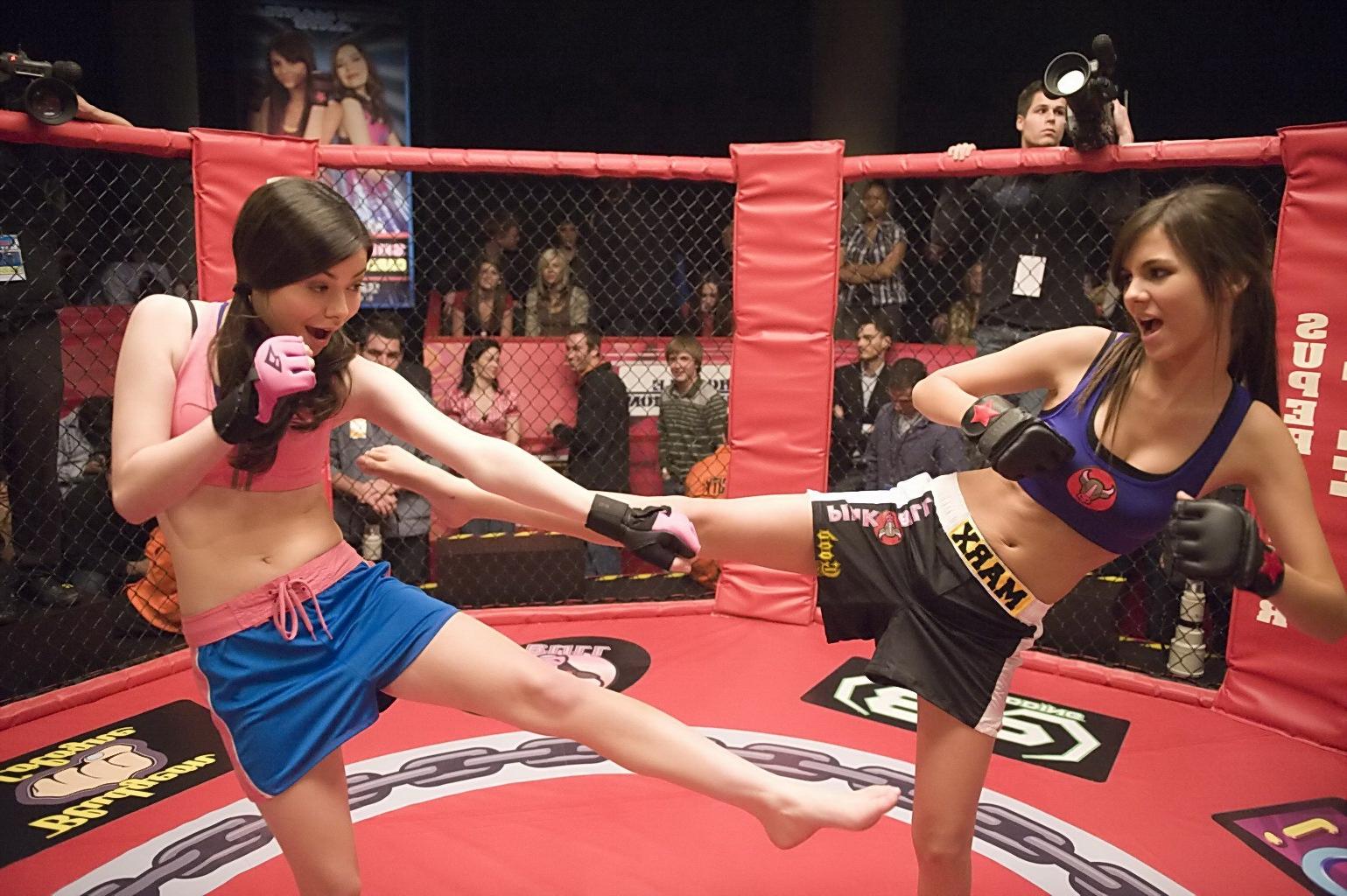16P Miranda Cosgrove wearing sports bra and shorts boxing with Victoria Justice on t
