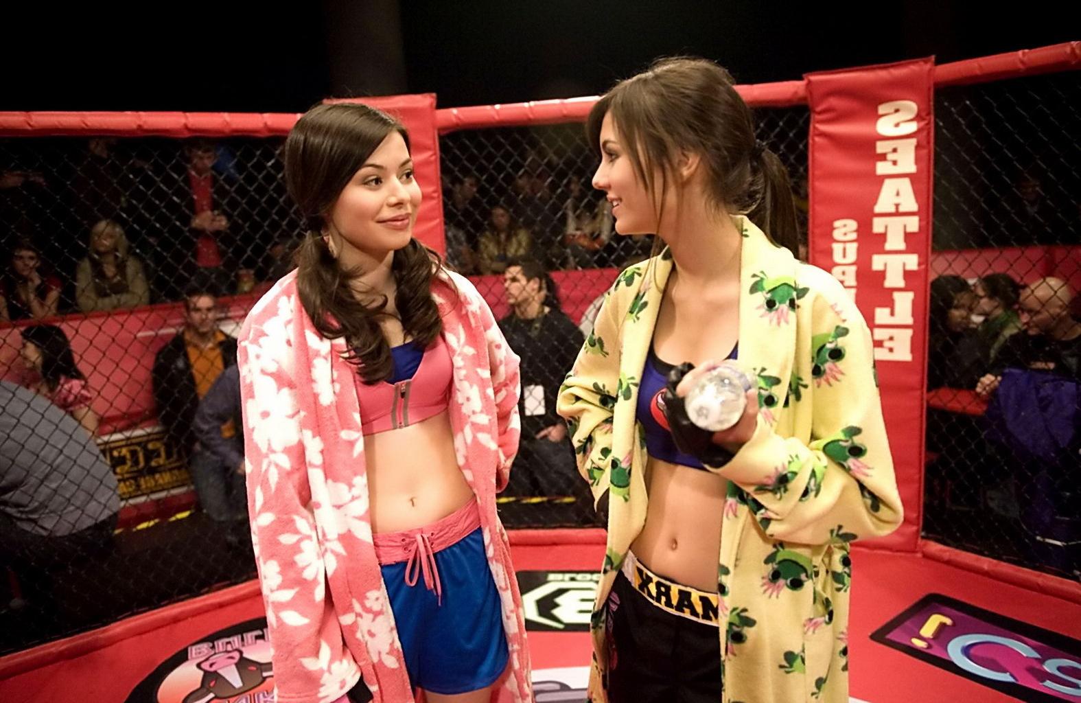 16P Miranda Cosgrove wearing sports bra and shorts boxing with Victoria Justice on t