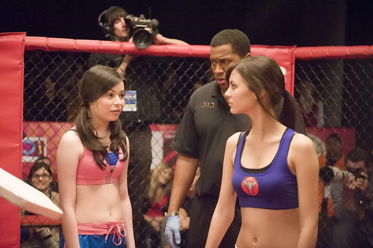 16P Miranda Cosgrove wearing sports bra and shorts boxing with Victoria Justice on t