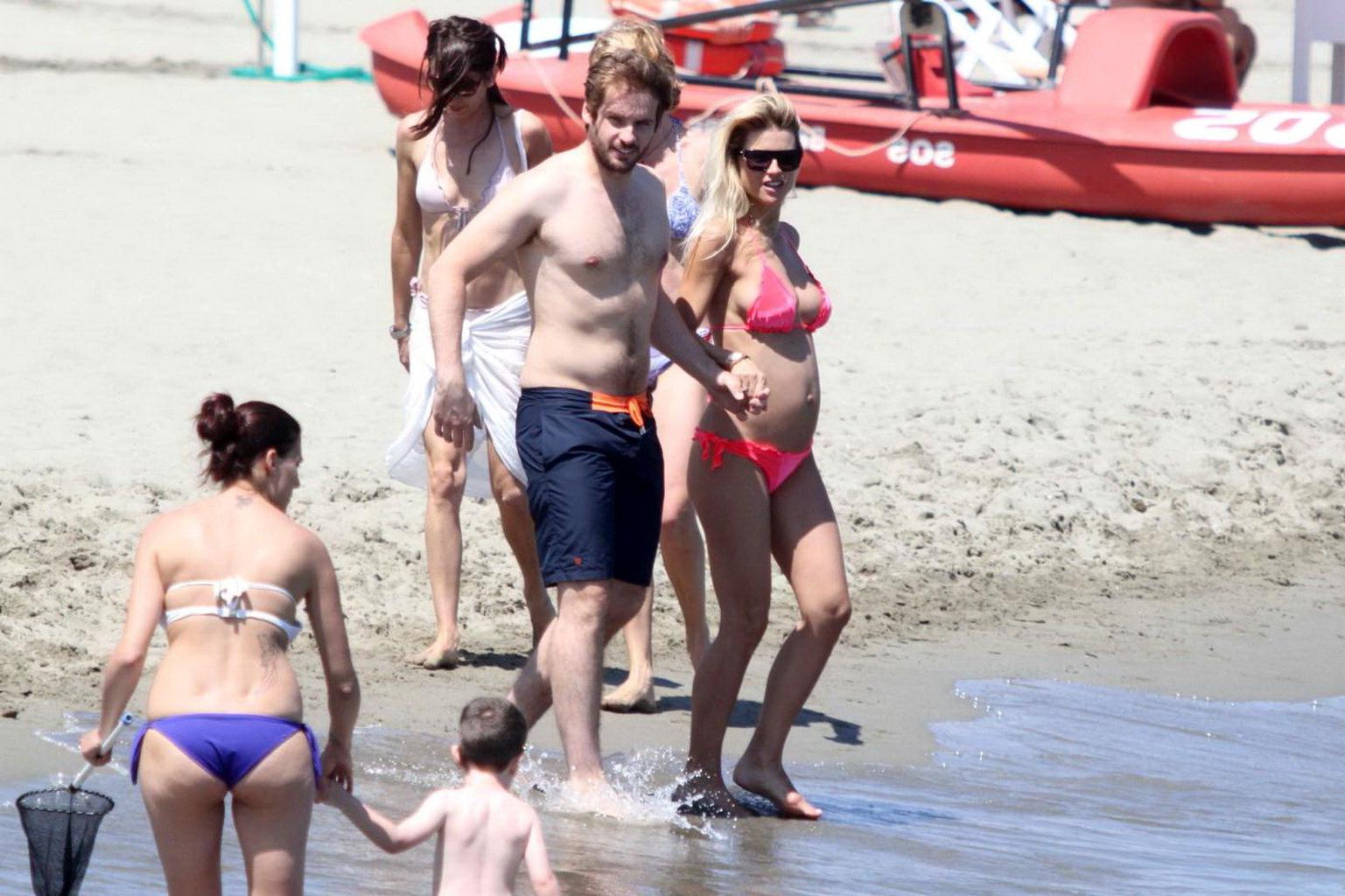 16P Michelle Hunziker pregnant wearing a bikini on the beach in Forte dei Marmi, Ita