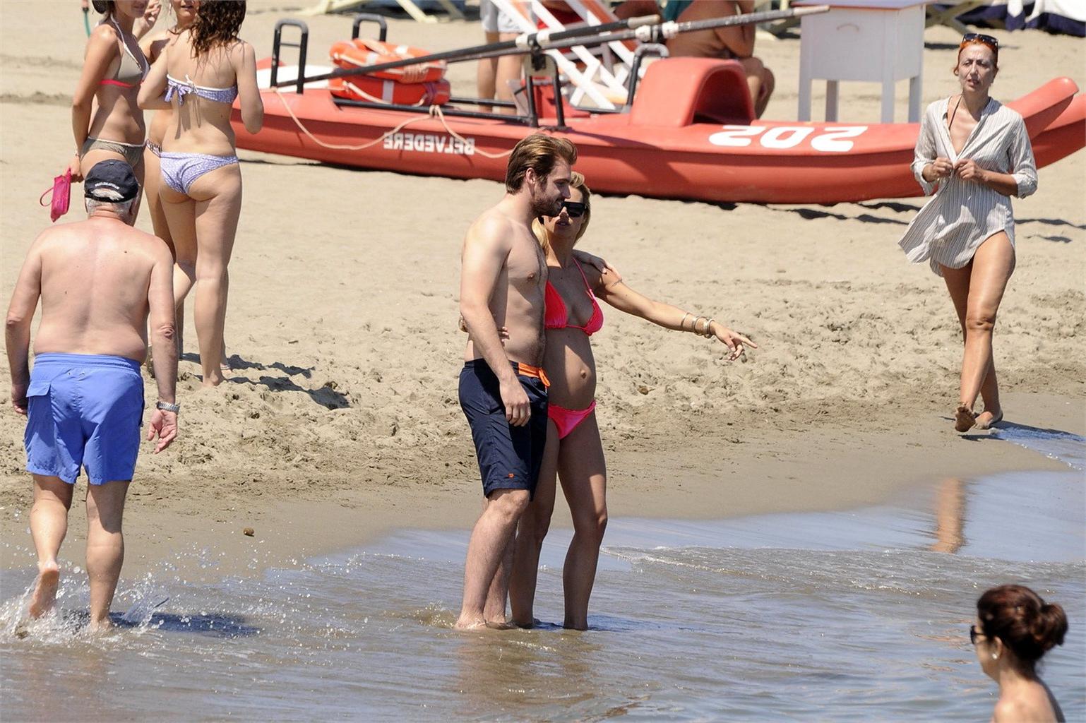 16P Michelle Hunziker pregnant wearing a bikini on the beach in Forte dei Marmi, Ita