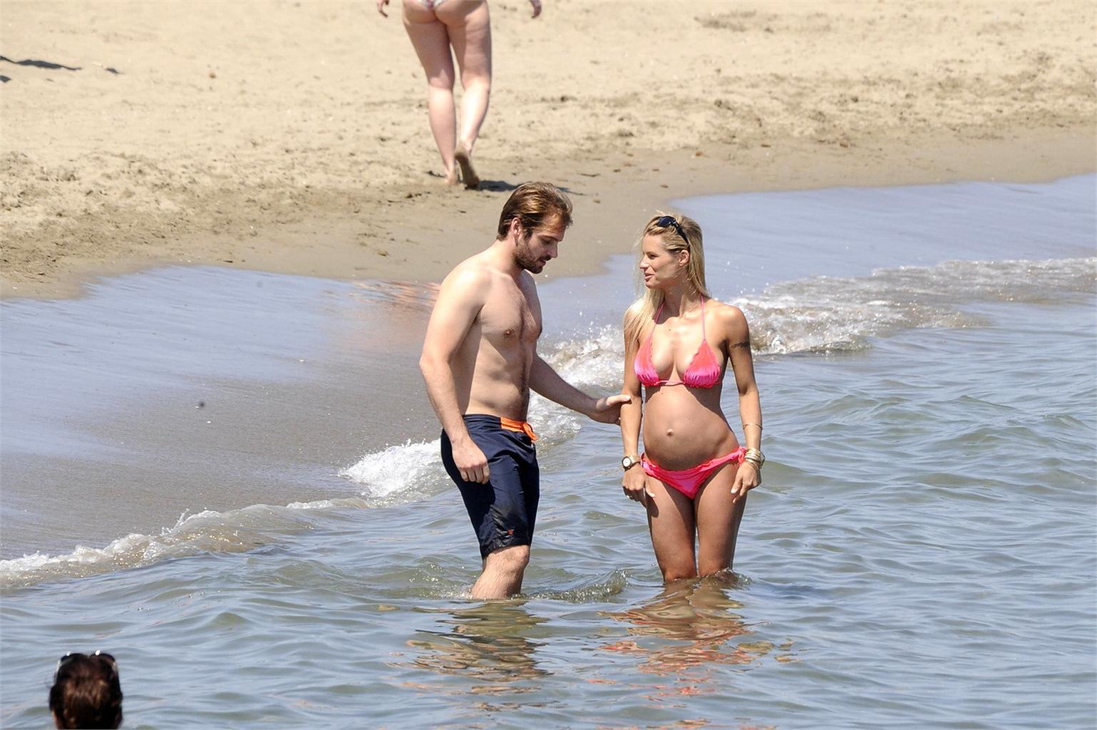 16P Michelle Hunziker pregnant wearing a bikini on the beach in Forte dei Marmi, Ita
