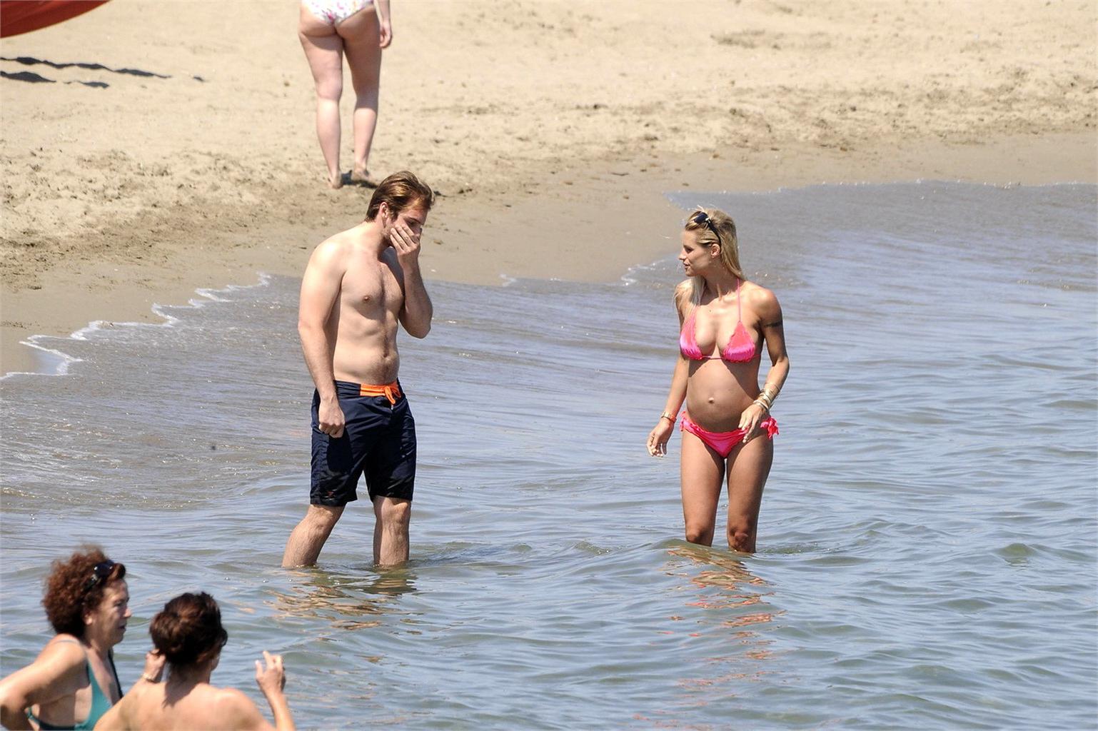 16P Michelle Hunziker pregnant wearing a bikini on the beach in Forte dei Marmi, Ita