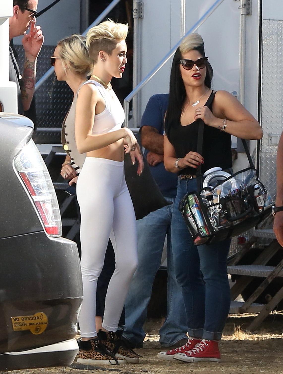 16P Miley Cyrus wearing the white tights  a sports bra on a music video set in LA