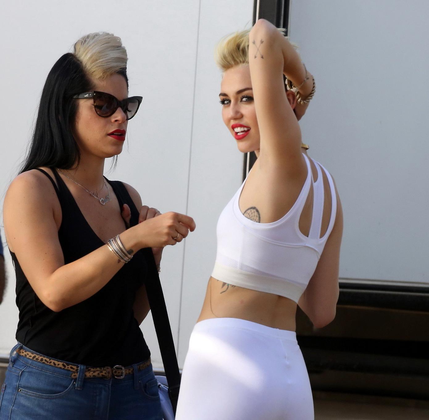 16P Miley Cyrus wearing the white tights  a sports bra on a music video set in LA