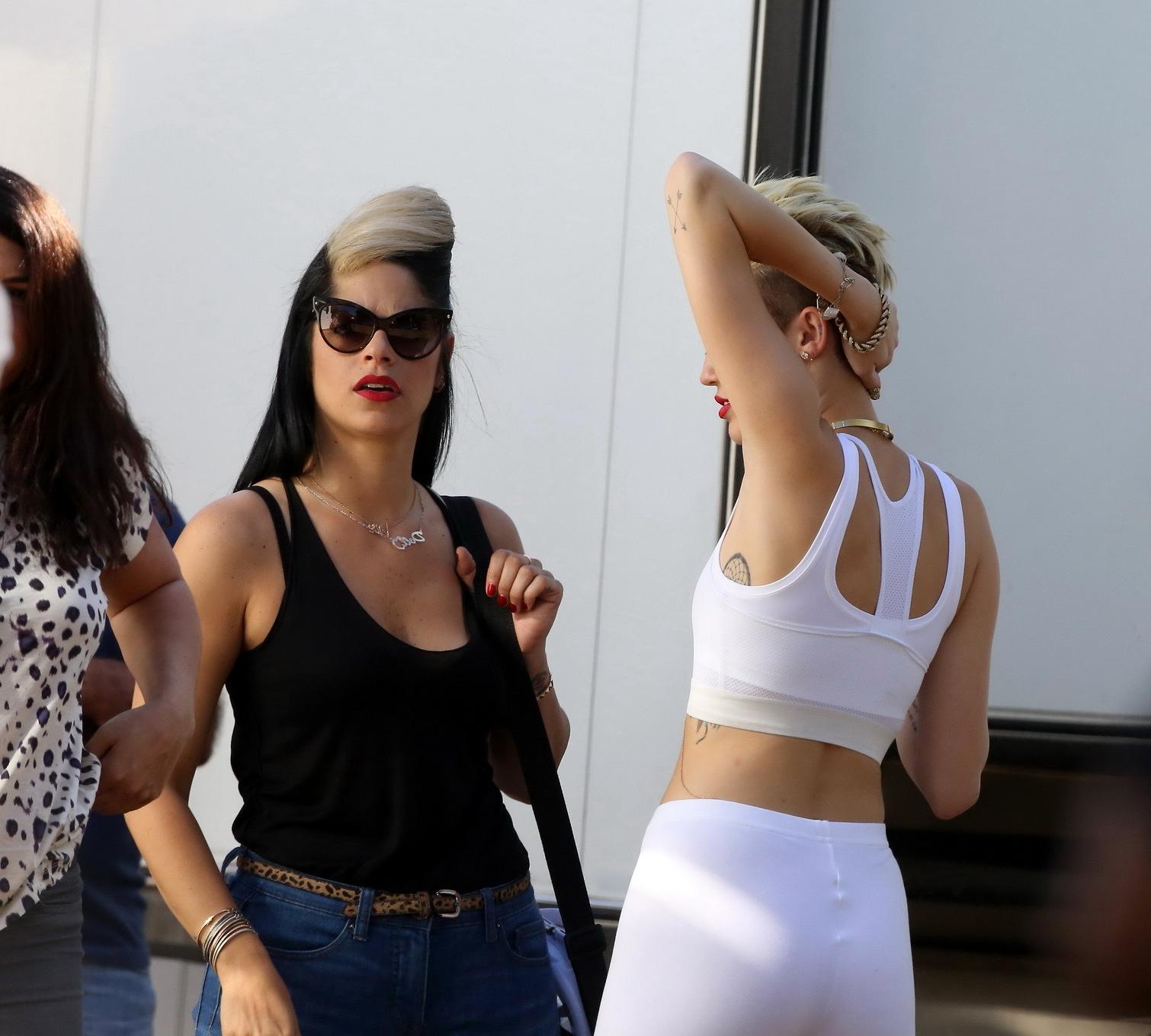 16P Miley Cyrus wearing the white tights  a sports bra on a music video set in LA