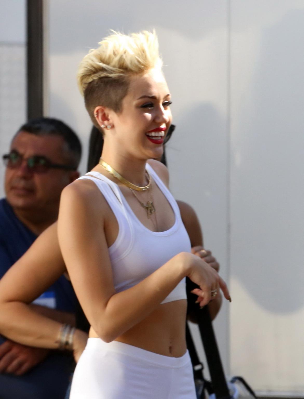 16P Miley Cyrus wearing the white tights  a sports bra on a music video set in LA