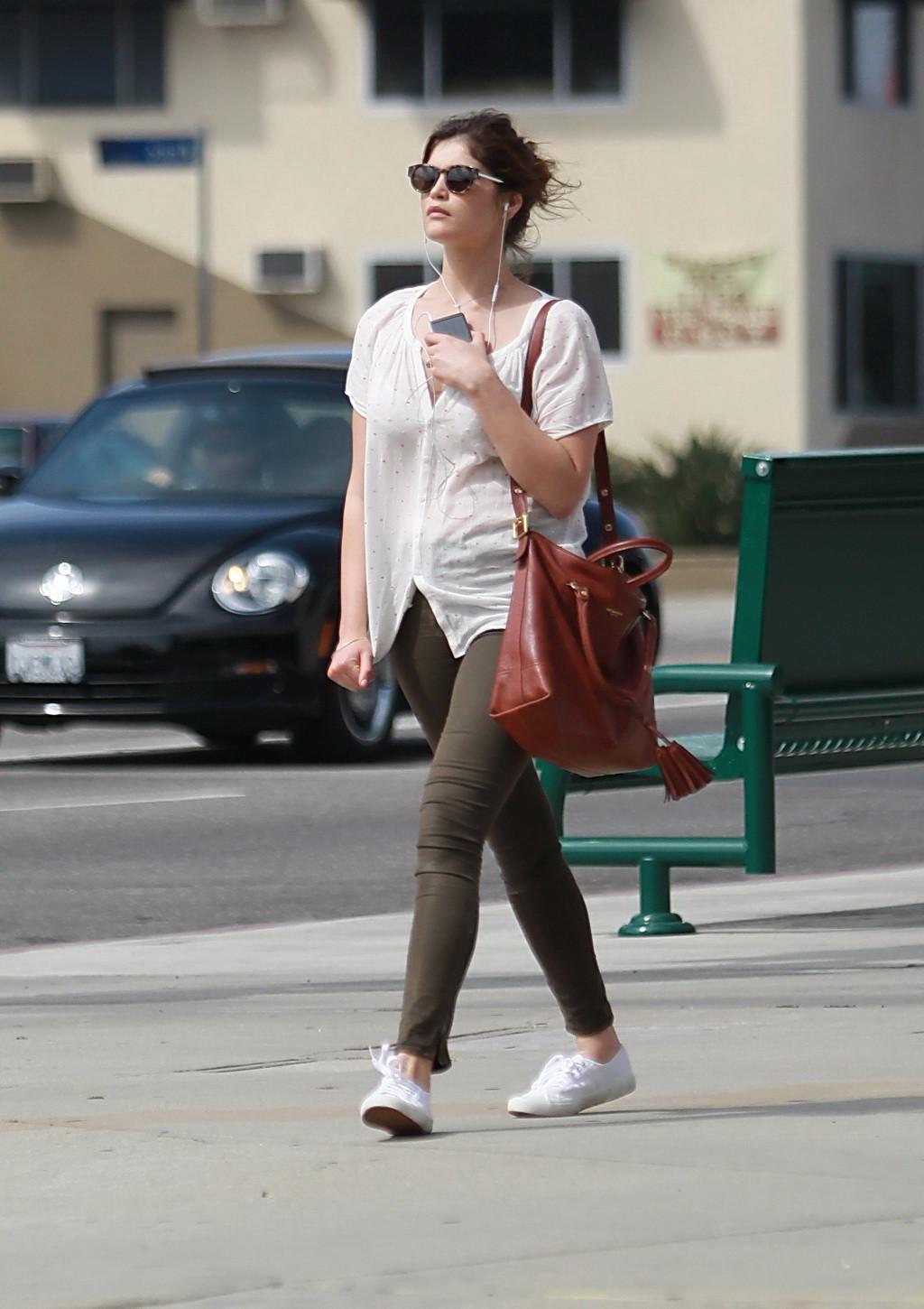 16P Gemma Arterton cleavy wearing see-thru to bra top and skintight pants out in Hol