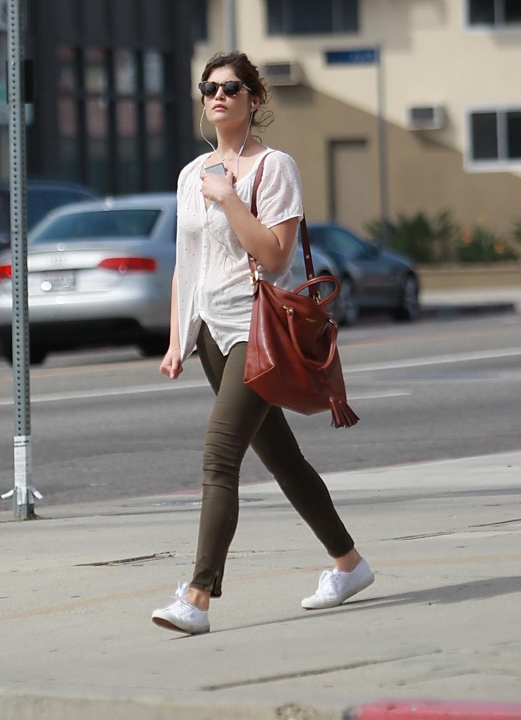 16P Gemma Arterton cleavy wearing see-thru to bra top and skintight pants out in Hol