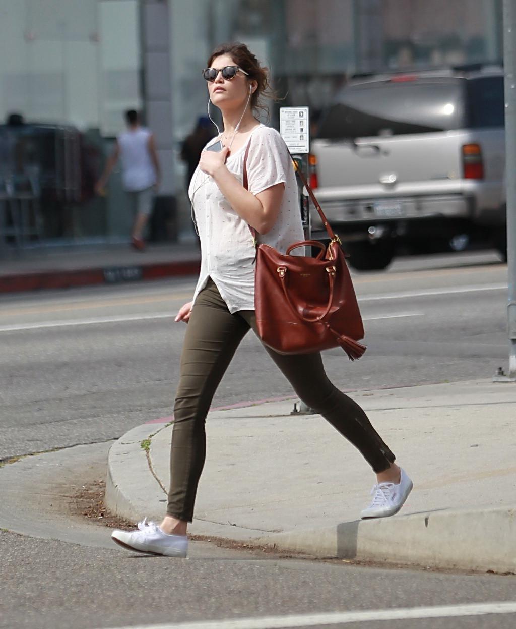 16P Gemma Arterton cleavy wearing see-thru to bra top and skintight pants out in Hol
