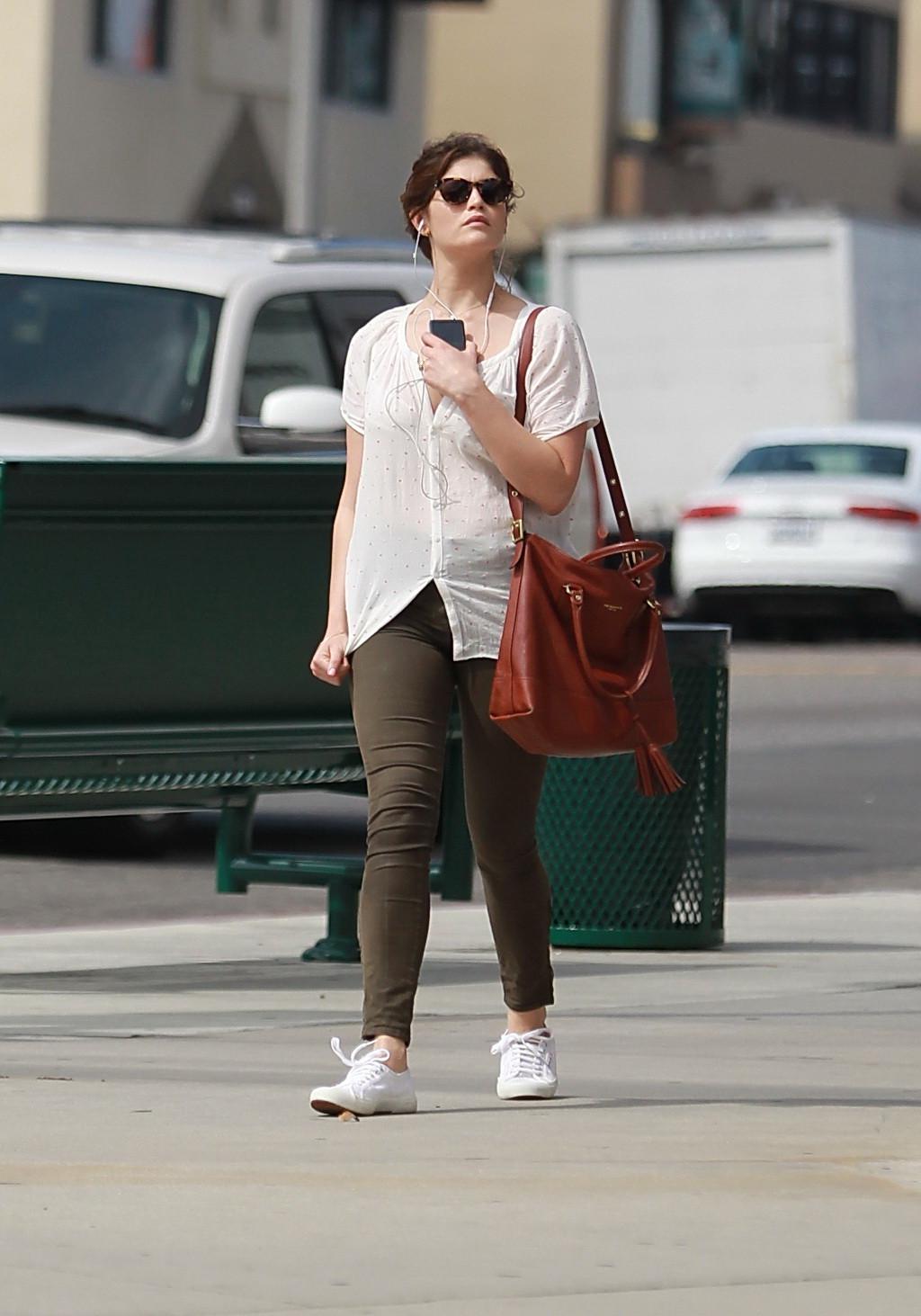 16P Gemma Arterton cleavy wearing see-thru to bra top and skintight pants out in Hol