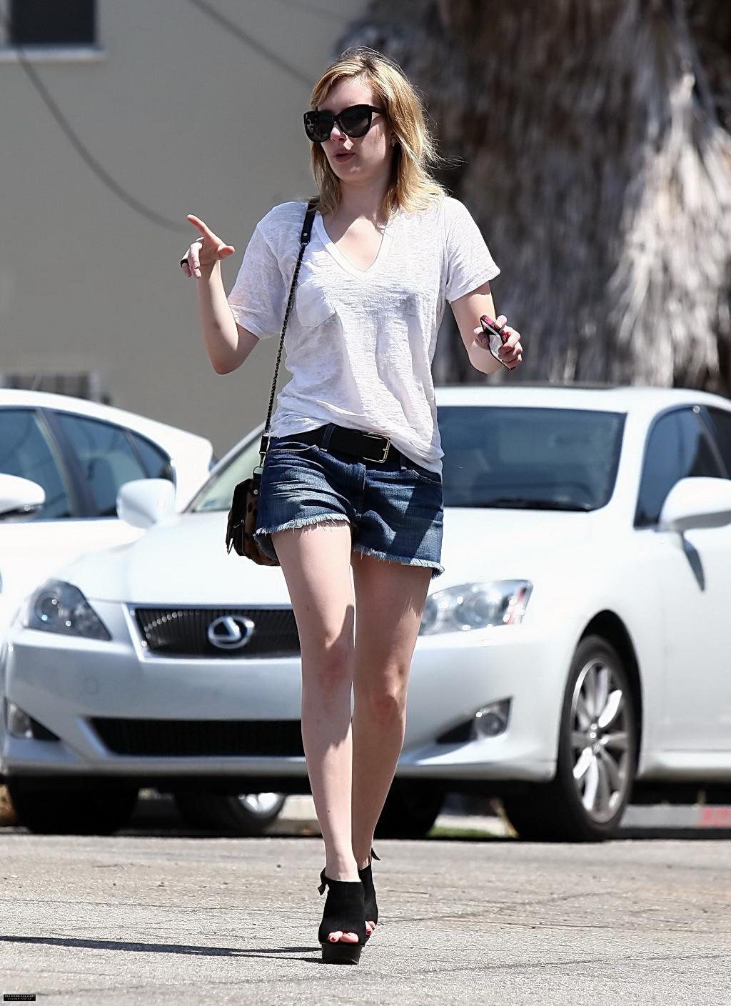 10P Emma Roberts wearing see-through to bra and denim shorts at the gas station in W