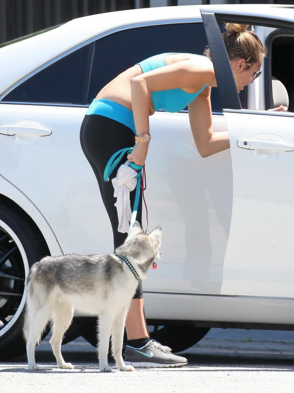 9P Miley Cyrus shows off her ass wearing sports bra  tights for a jog in LA
