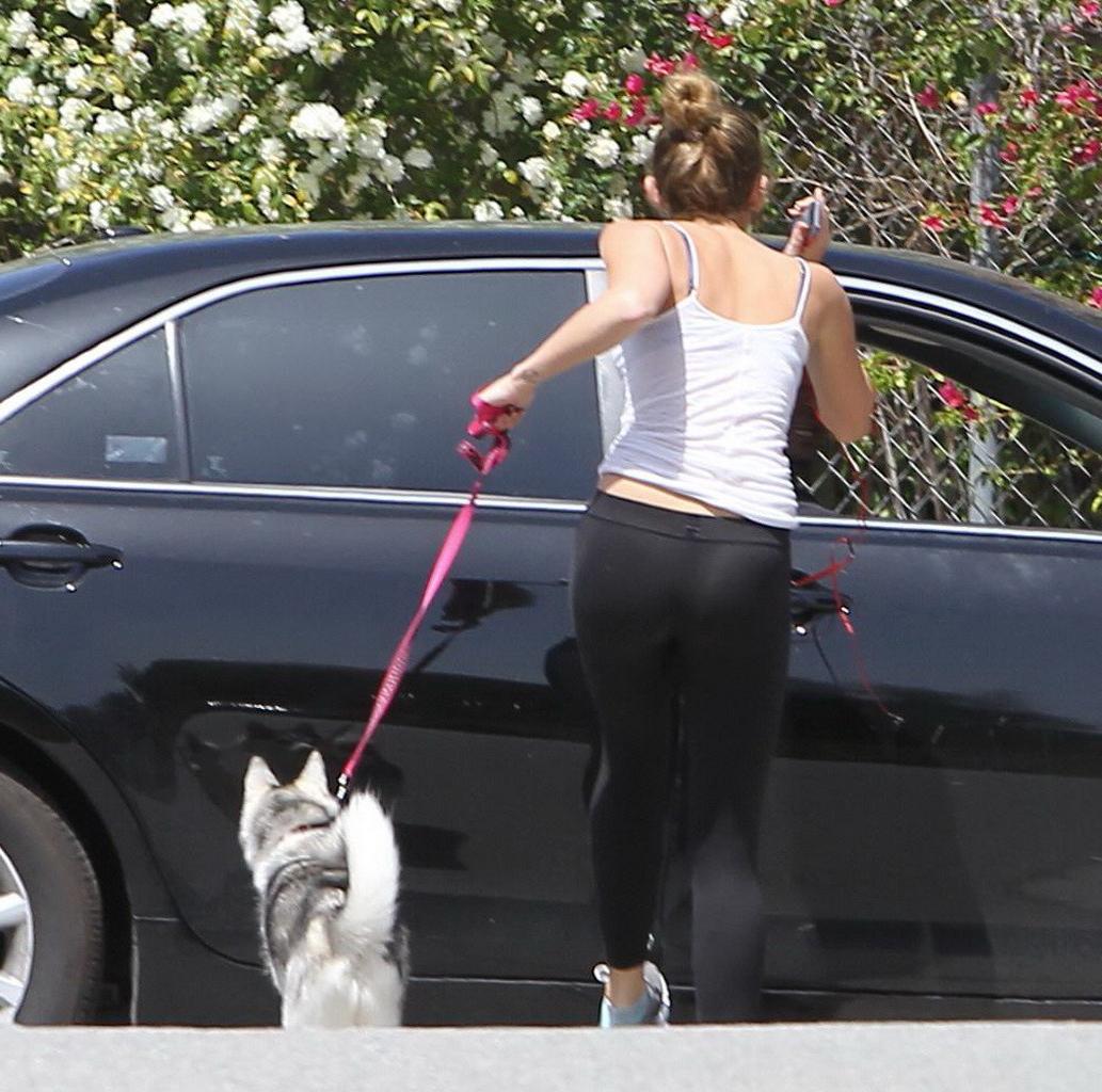 16P Miley Cyrus see through to bra while running out her dog in Toluca Lake