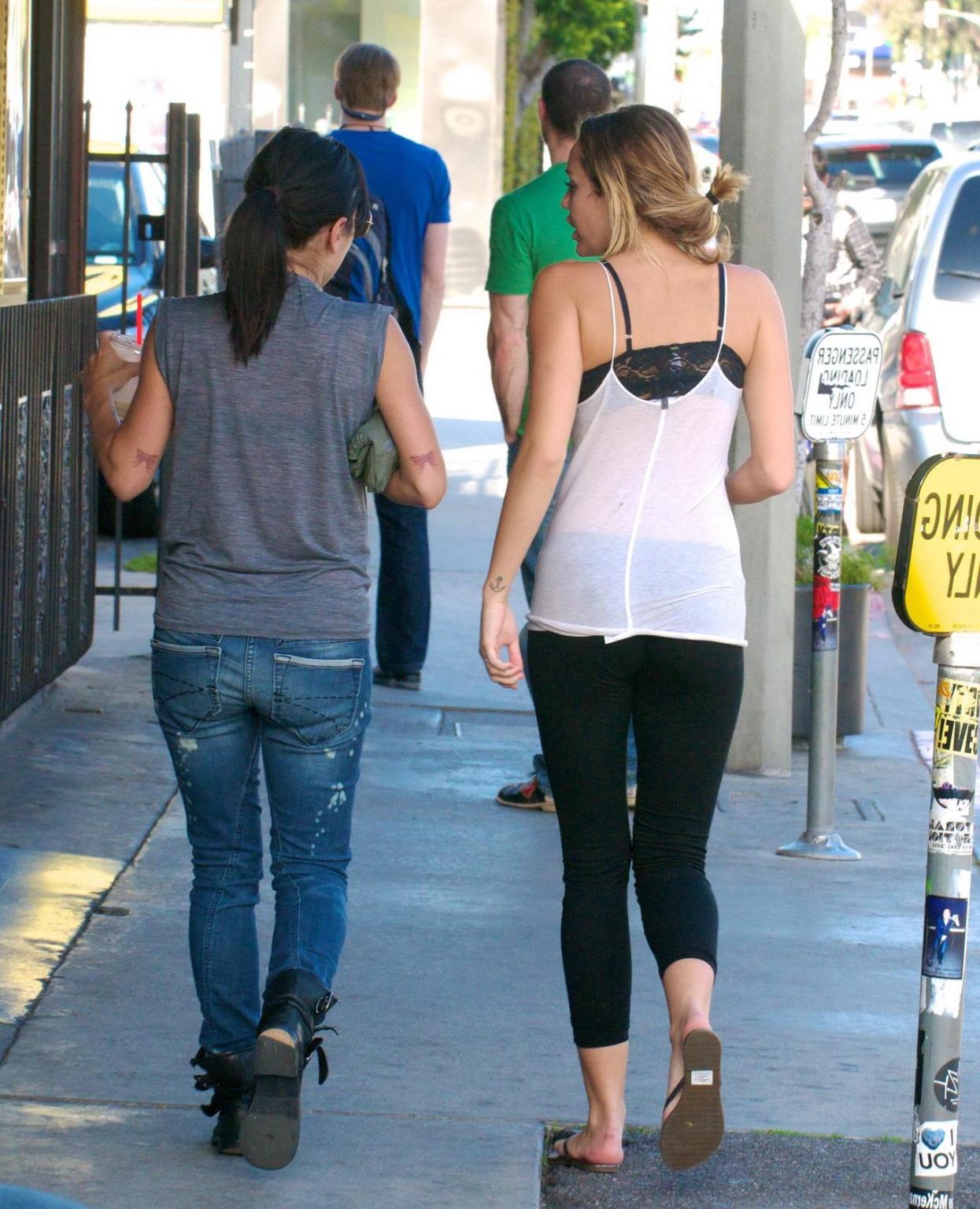 16P Miley Cyrus see-through to bra leaving a pilates class in LA