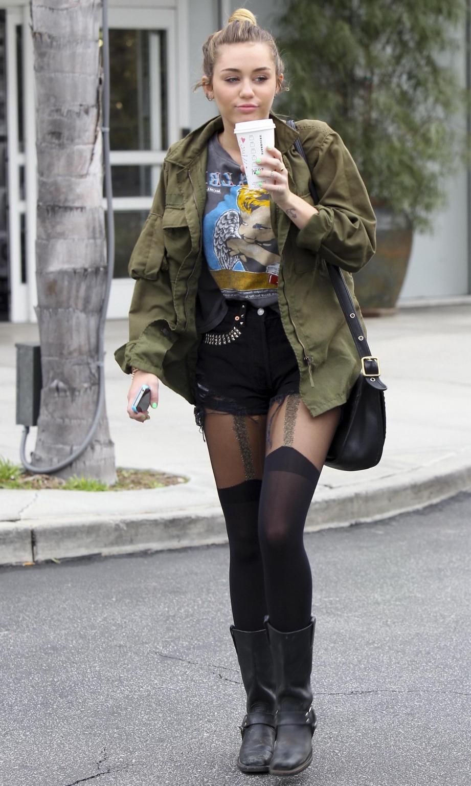 16P Miley Cyrus leggy wearing stockings  biker boots outside Starbucks in Hollywood