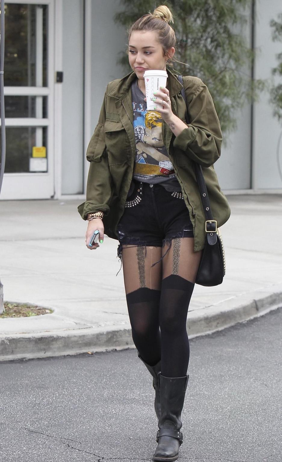 16P Miley Cyrus leggy wearing stockings  biker boots outside Starbucks in Hollywood
