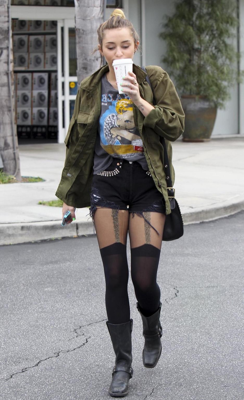 16P Miley Cyrus leggy wearing stockings  biker boots outside Starbucks in Hollywood