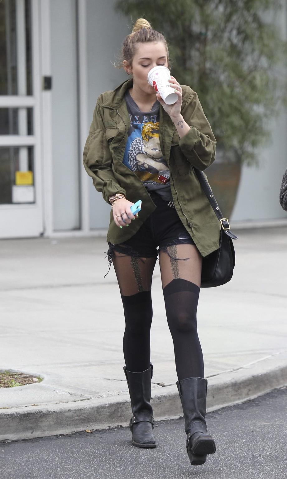 16P Miley Cyrus leggy wearing stockings  biker boots outside Starbucks in Hollywood